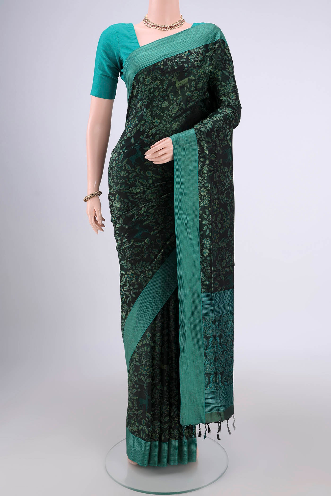 Olive Green Dual Tone Baluchari Silk Saree with Jacquard design on the body and Zari Border.  displayed on a mannequin