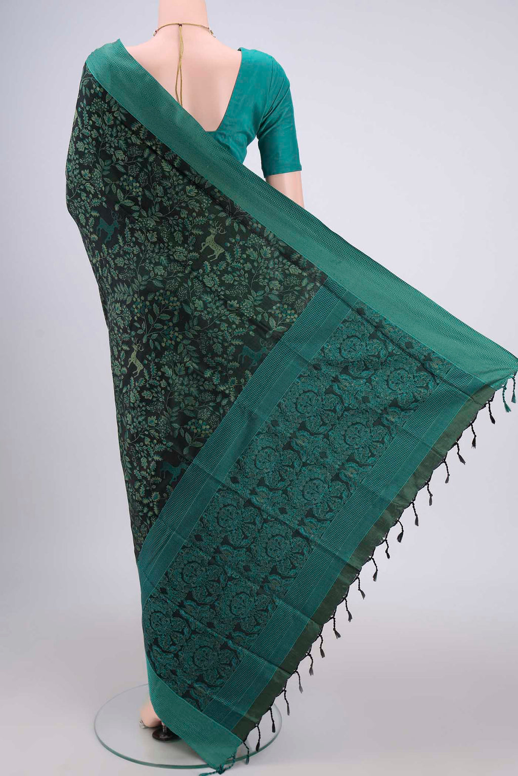 Flat view of Olive Green Dual Tone Baluchari Silk Saree with Jacquard design on the body and Zari Border. 