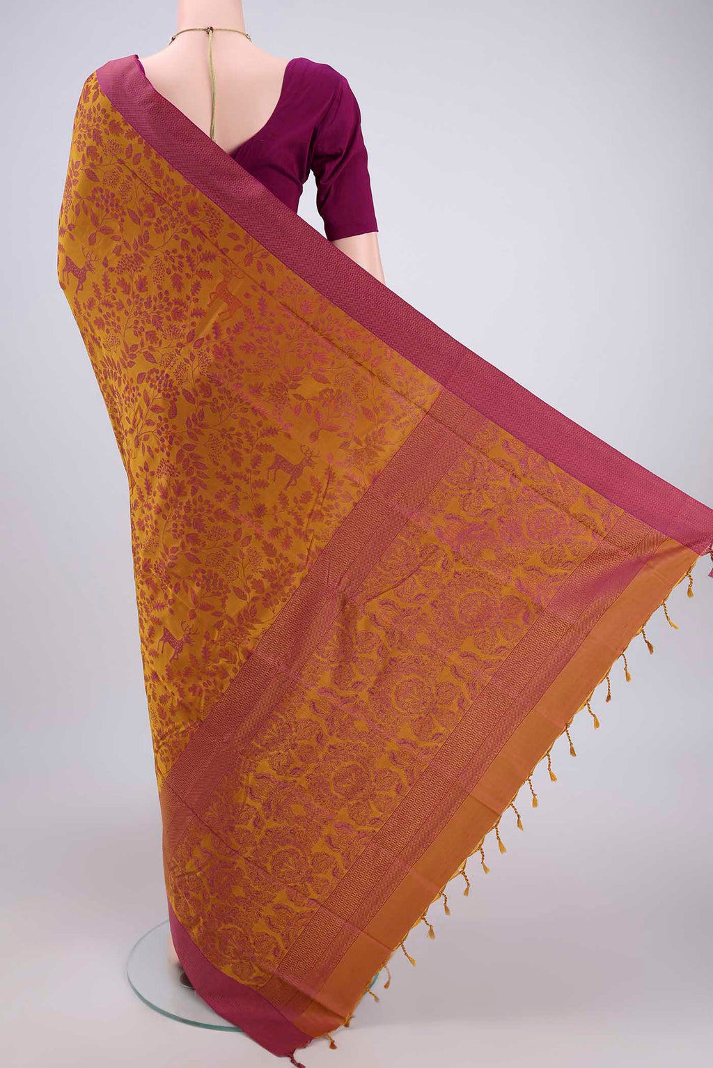 Flat view of Mustard Dual Tone Baluchari Silk Saree with Jacquard design on the body and Zari Border. 