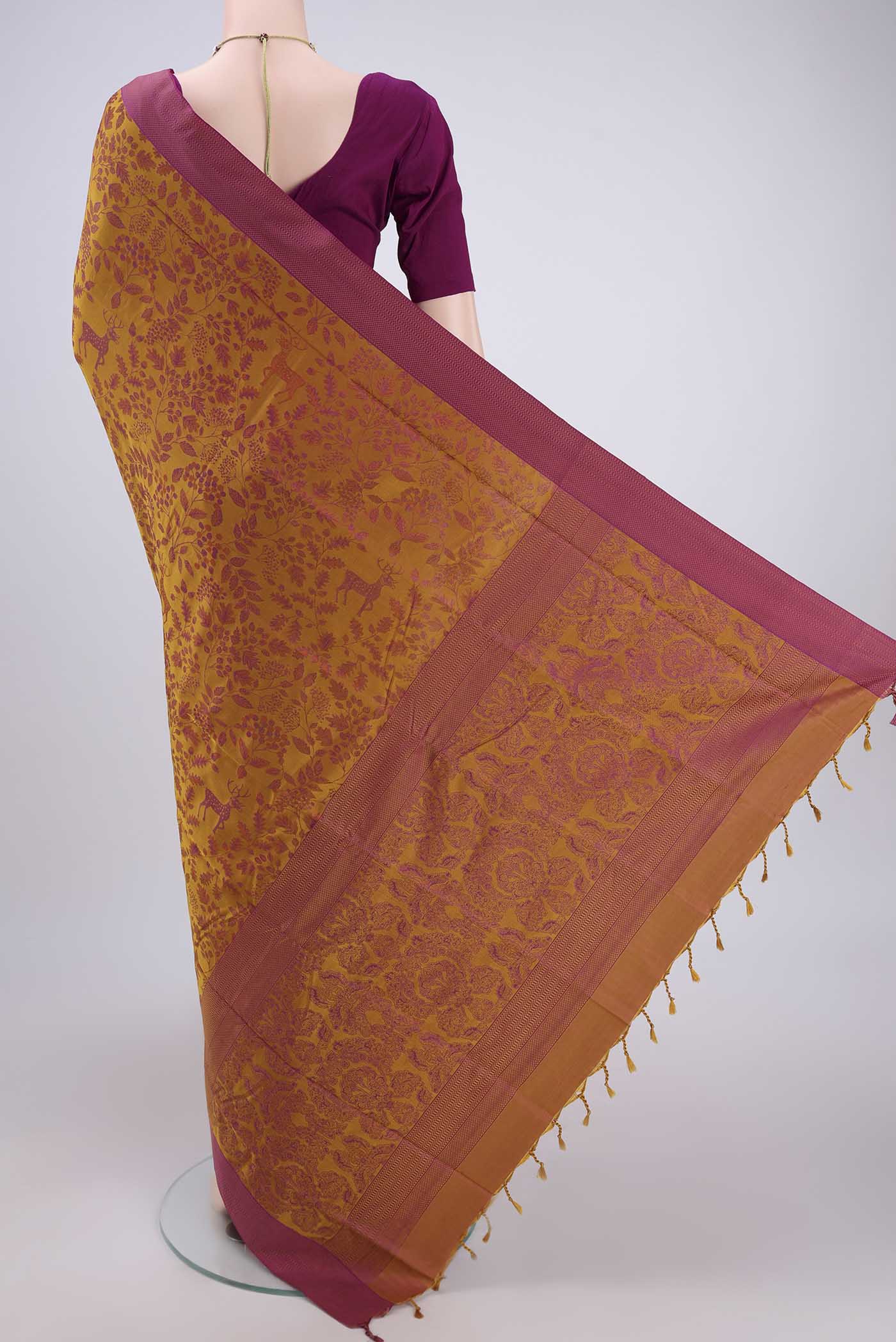 Flat view of Mustard Dual Tone Baluchari Silk Saree with Jacquard design on the body and Zari Border. 