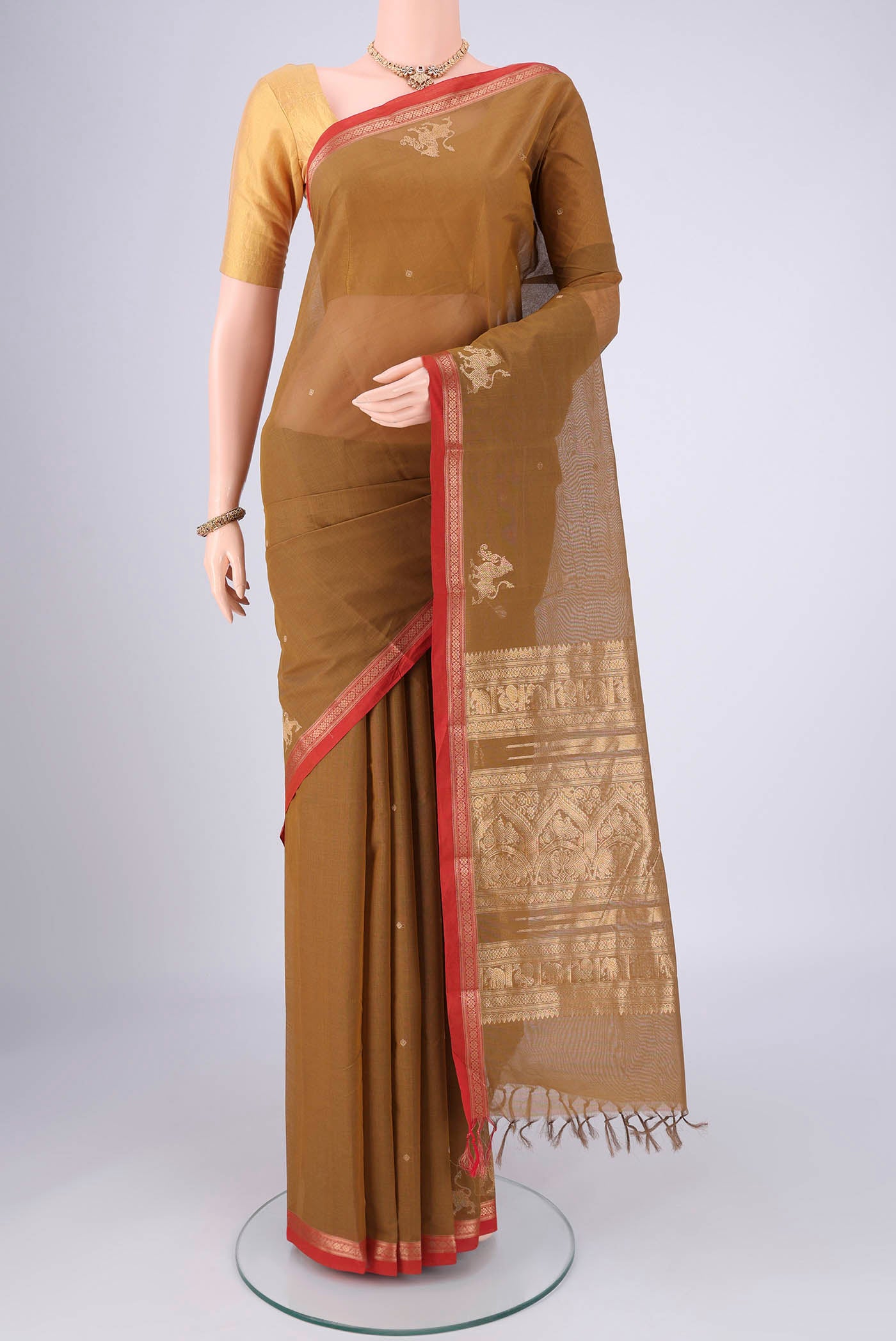 Mehandi Green Kanchi Cotton Saree with Plain Body and Zari Border.  displayed on a mannequin