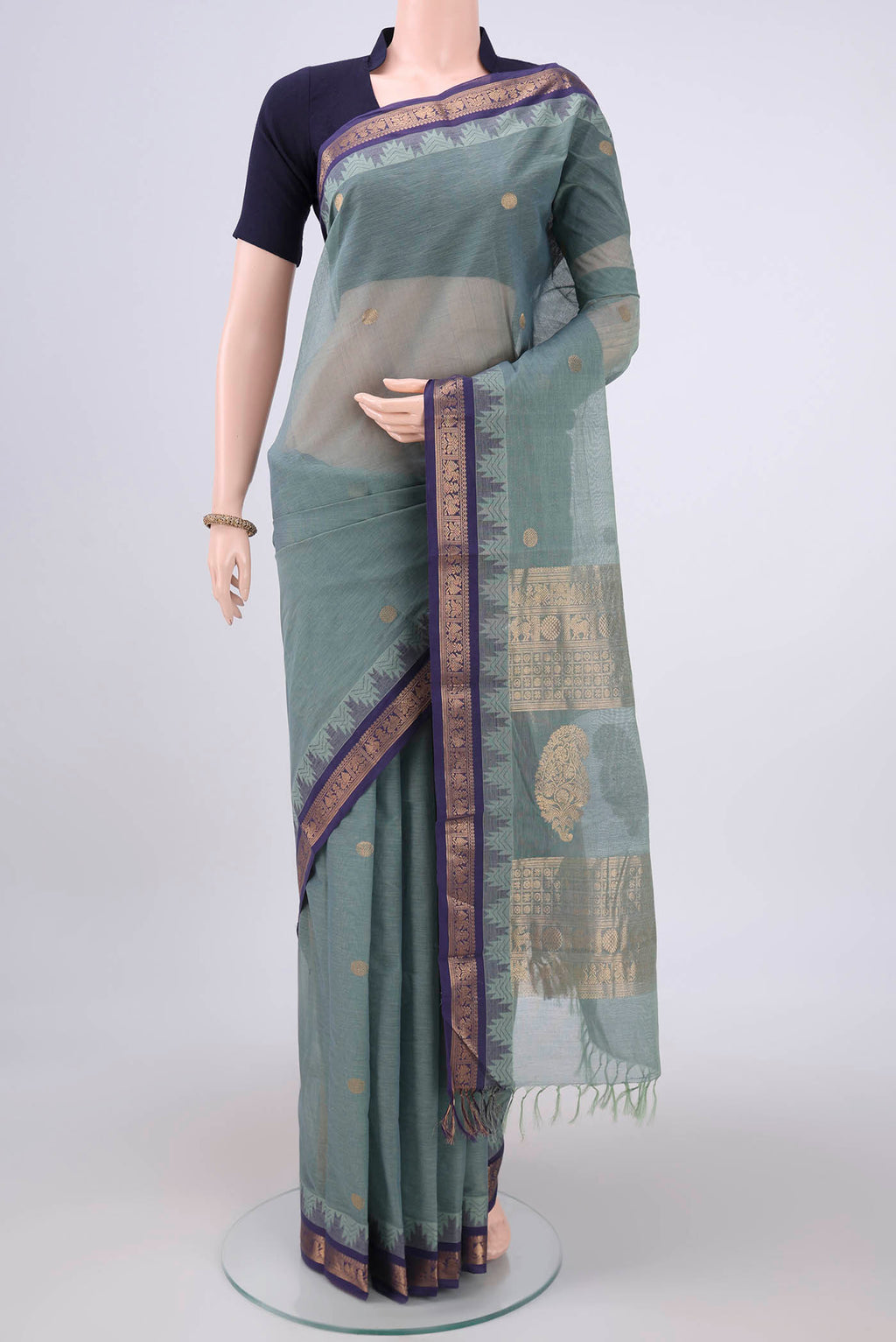 Davys Grey Kanchi Cotton Saree with Zari Butta on the body and Zari Border.  displayed on a mannequin