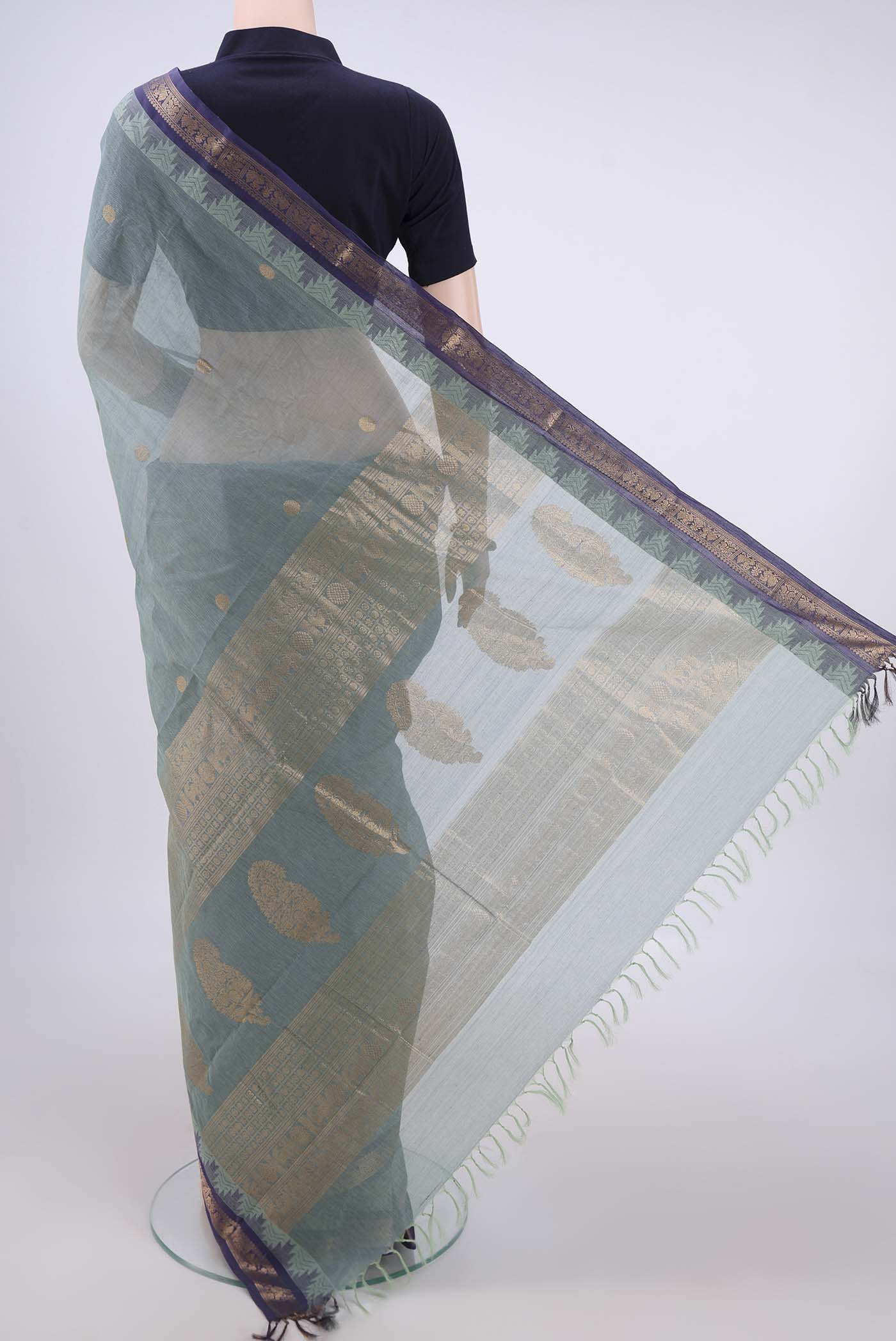 Flat view of Davys Grey Kanchi Cotton Saree with Zari Butta on the body and Zari Border. 