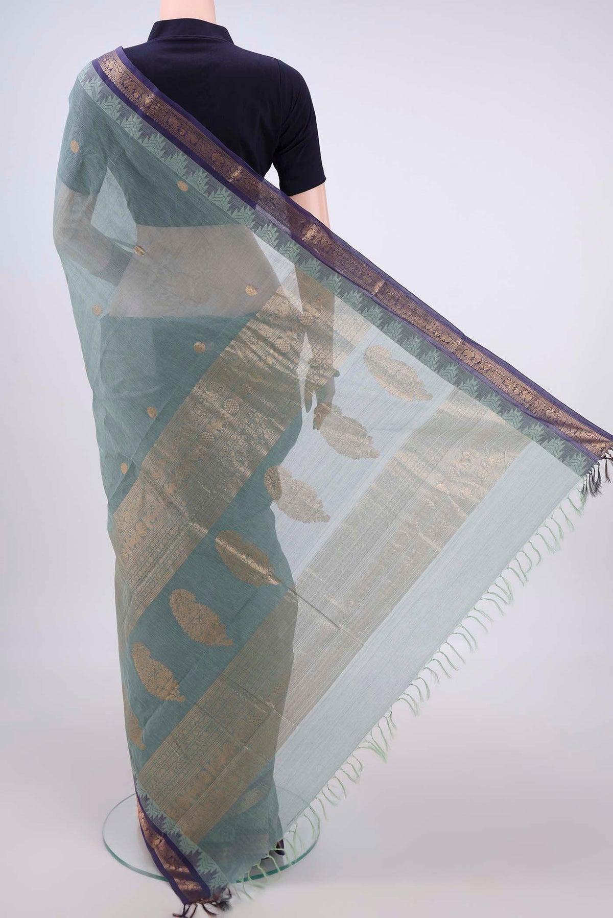 Flat view of Davys Grey Kanchi Cotton Saree with Zari Butta on the body and Zari Border. 