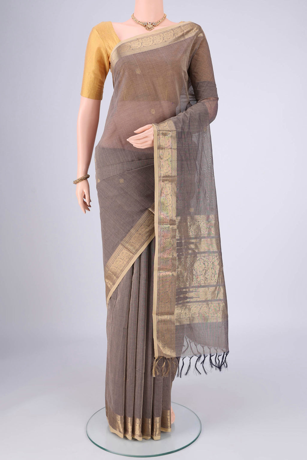 Grey Kanchi Cotton Saree with Plain Body and Zari Border.  displayed on a mannequin
