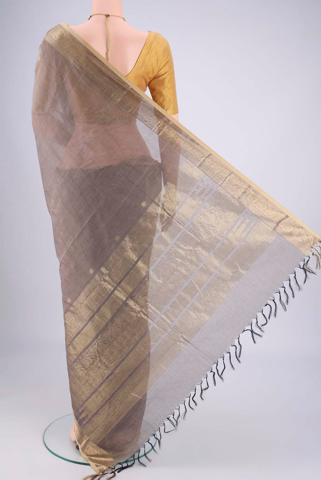 Flat view of Grey Kanchi Cotton Saree with Plain Body and Zari Border. 
