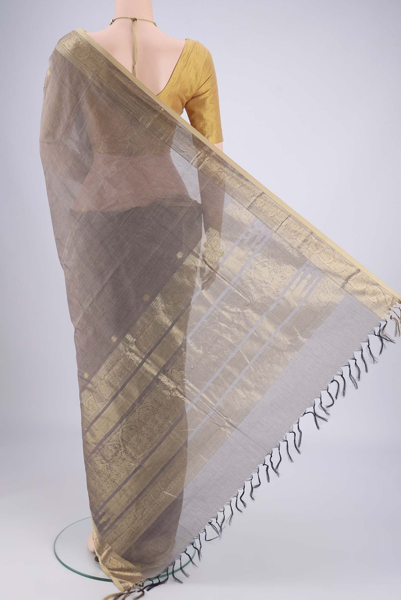 Flat view of Grey Kanchi Cotton Saree with Plain Body and Zari Border. 