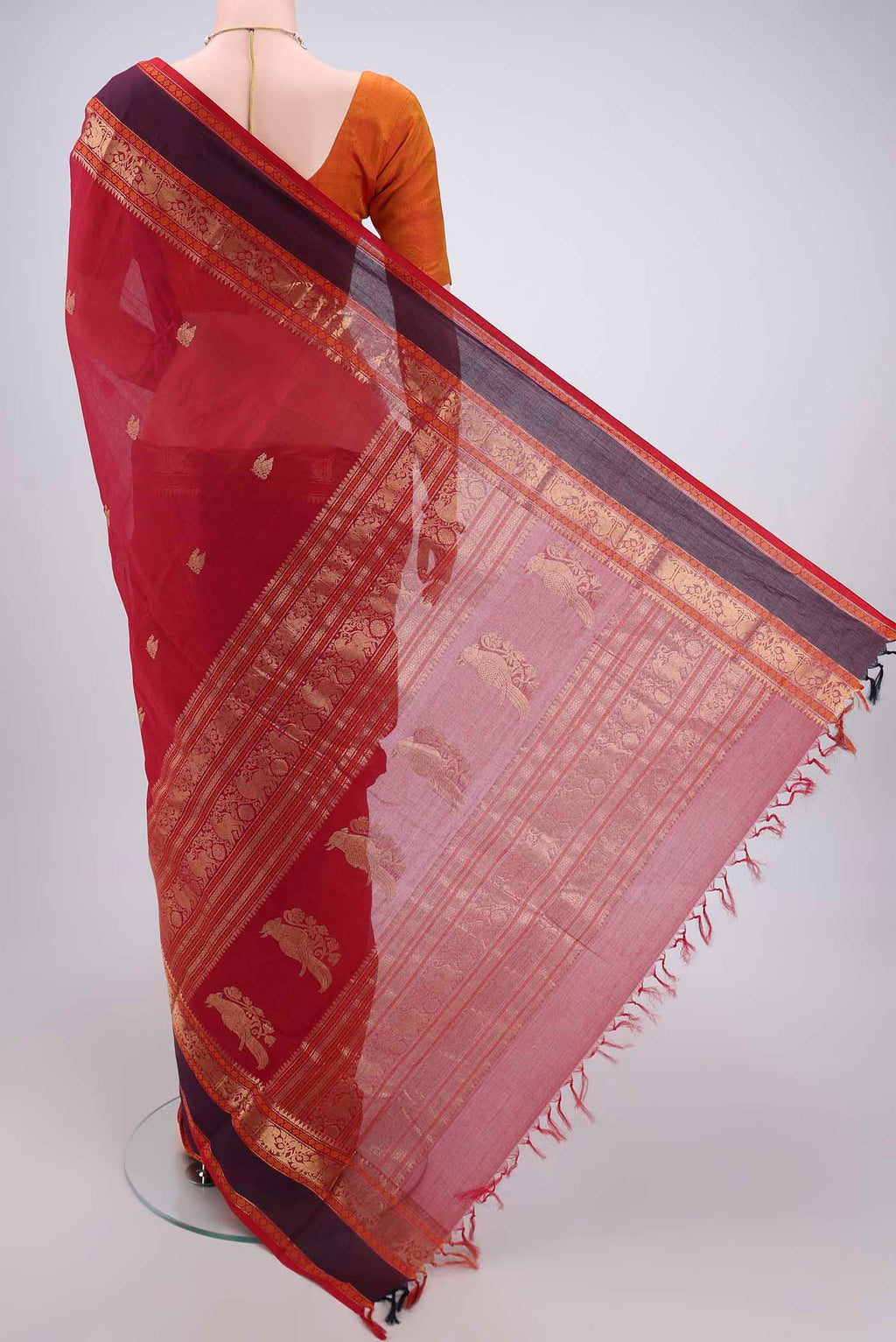 Flat view of Red Kanchi Cotton Saree with Zari Butta on the body and Zari Border. 