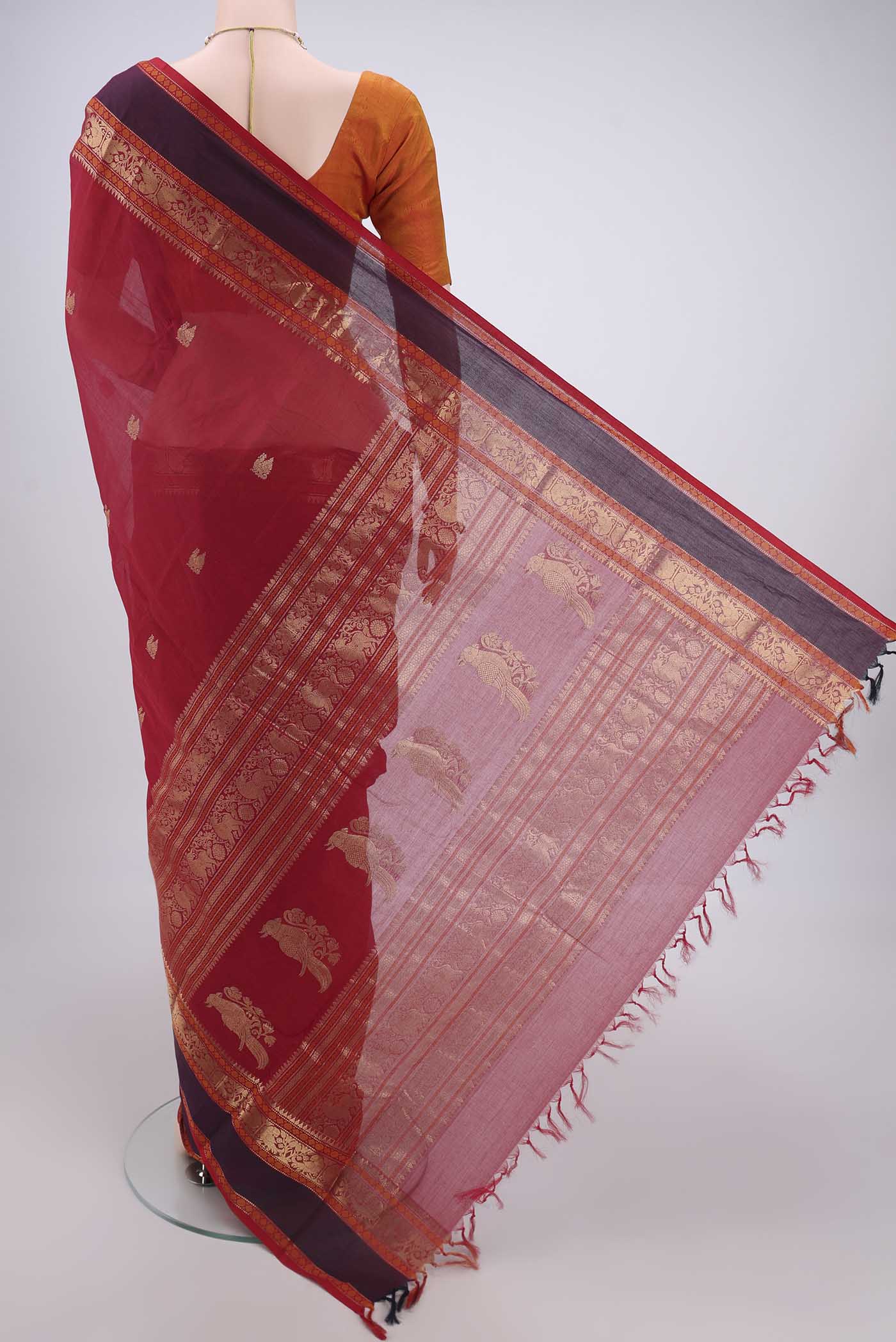 Flat view of Red Kanchi Cotton Saree with Zari Butta on the body and Zari Border. 
