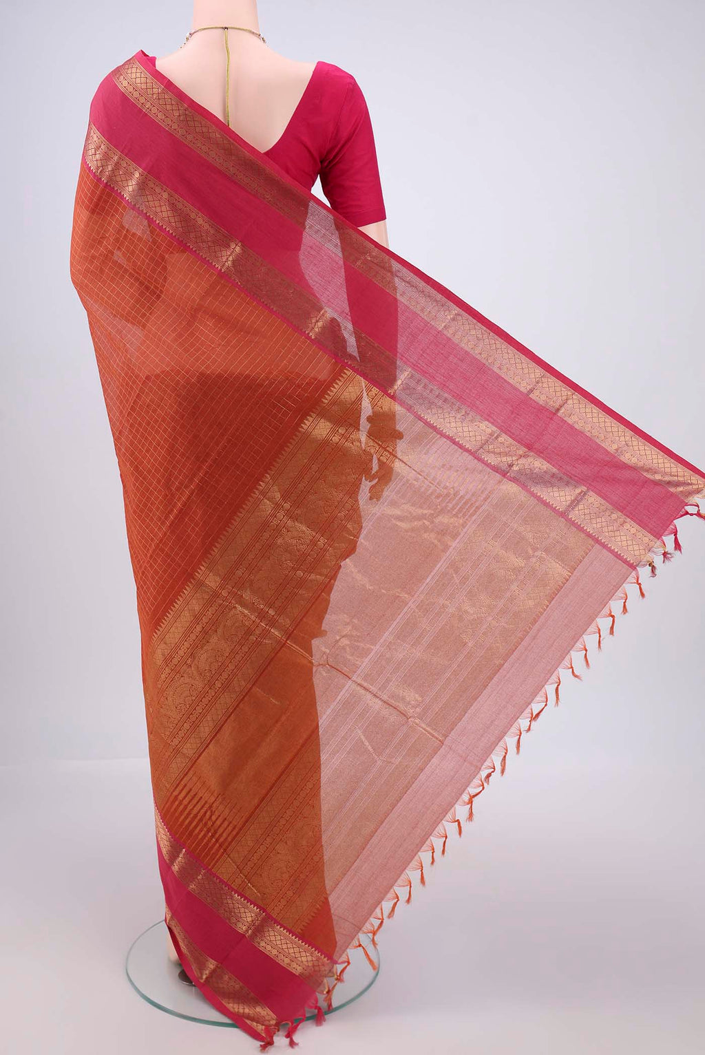Flat view of Rust Kanchi Cotton Saree with Checked design on the body and Zari Border. 
