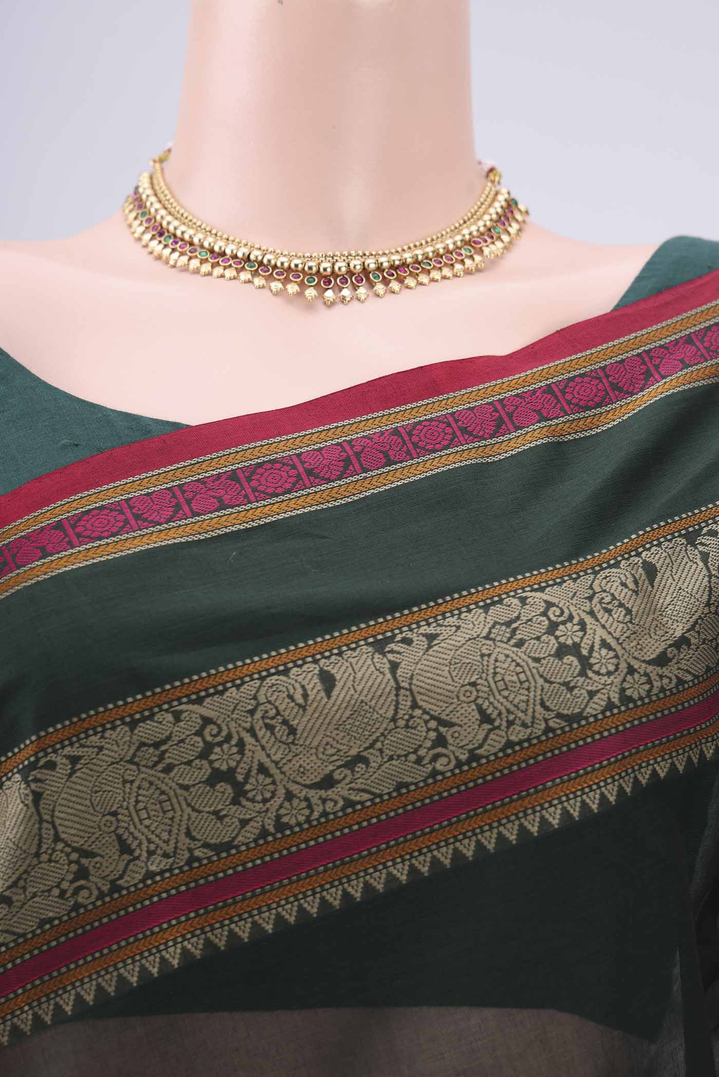 Border image of Bottle Green Kanchi Cotton Saree with Plain Body and Thread Border. 