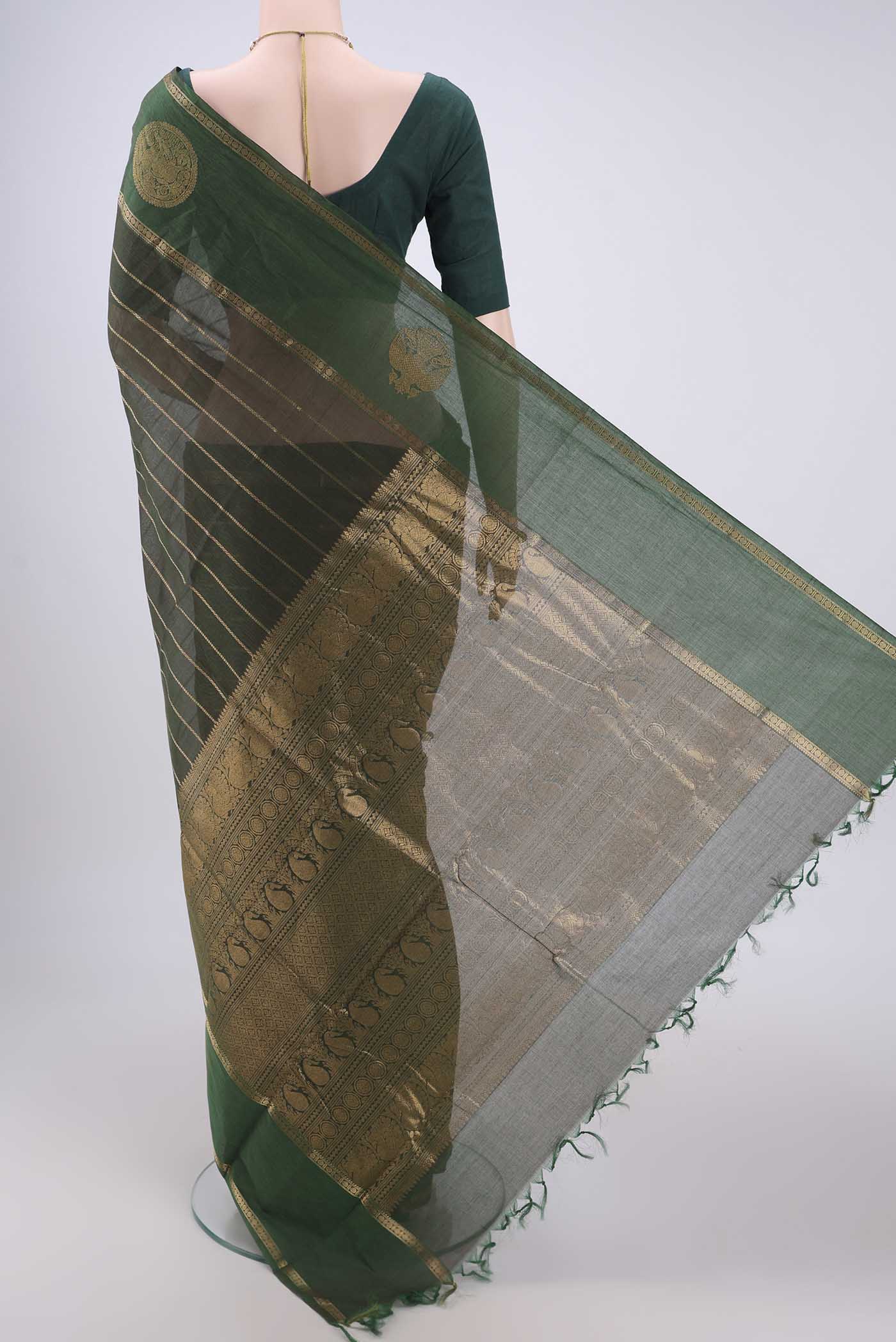 Flat view of Bottle Green Kanchi Cotton Saree with Stripes on the body and Zari Border. 