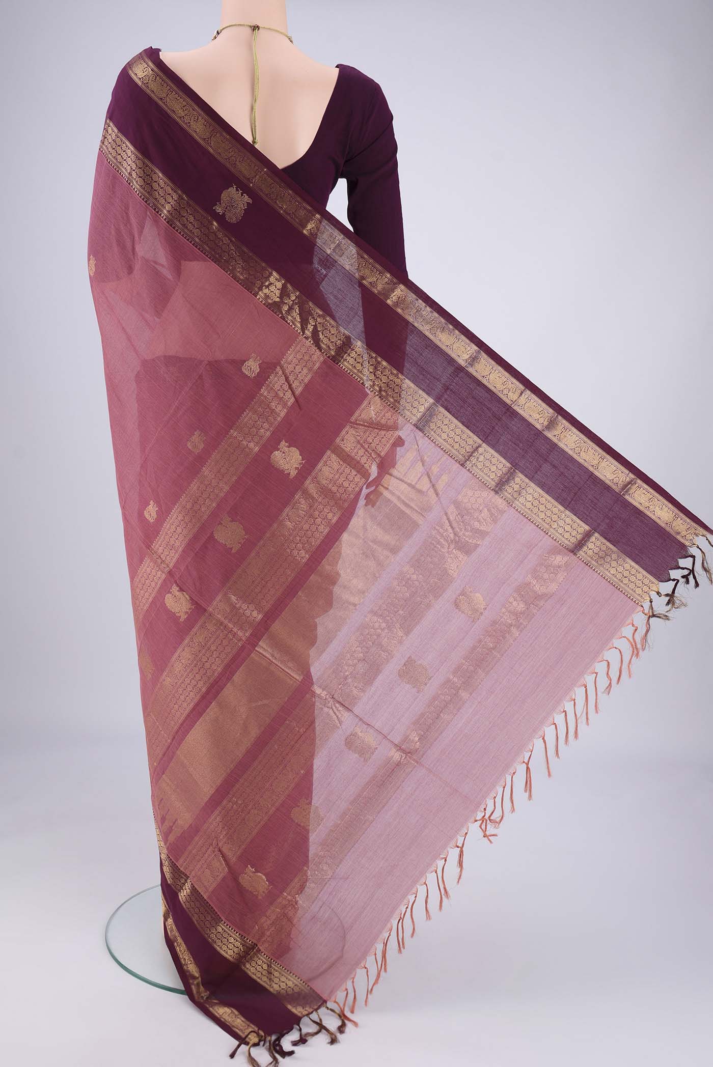 Flat view of Dark Mauve Kanchi Cotton Saree with Plain Body and Zari Border. 
