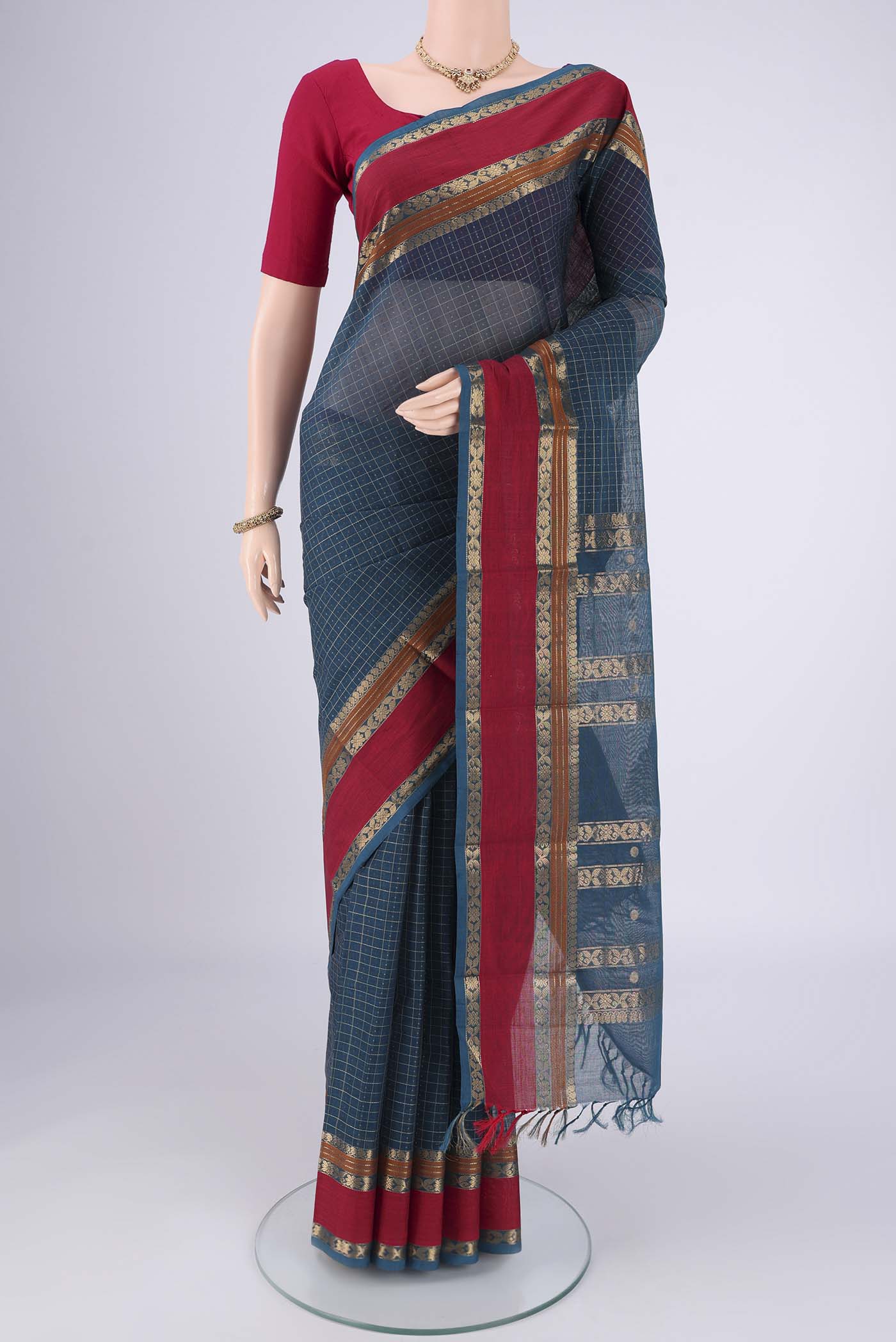 Grey Kanchi Cotton Saree with Plain Body and Zari Border.  displayed on a mannequin