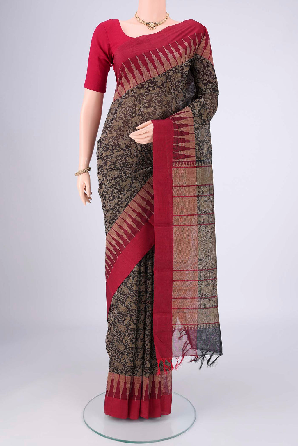 Black Kanchi Cotton Saree with Animal Print on the body and Zari Border.  displayed on a mannequin