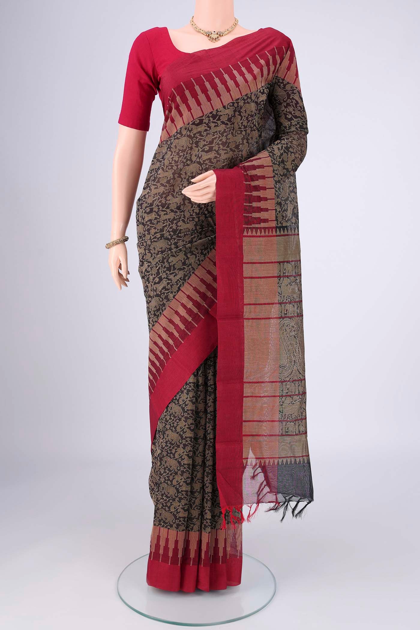Black Kanchi Cotton Saree with Animal Print on the body and Zari Border.  displayed on a mannequin