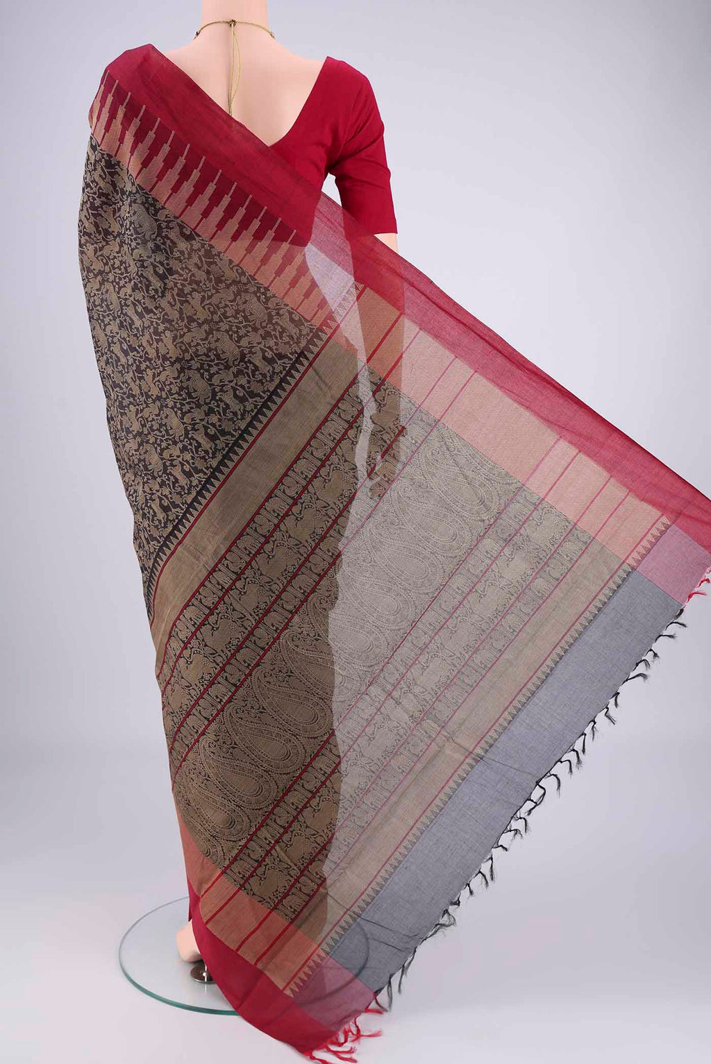 Flat view of Black Kanchi Cotton Saree with Animal Print on the body and Zari Border. 