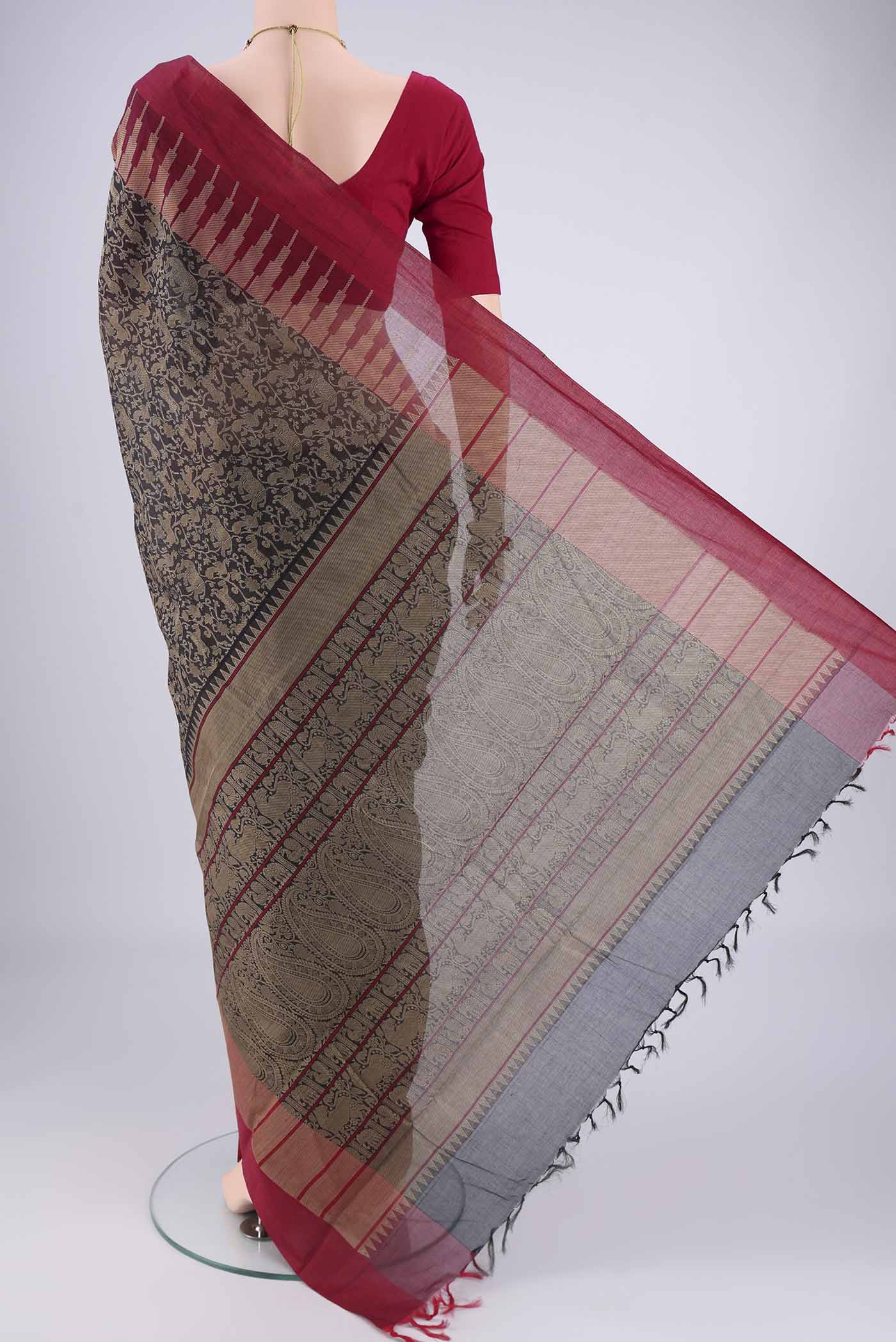 Flat view of Black Kanchi Cotton Saree with Animal Print on the body and Zari Border. 
