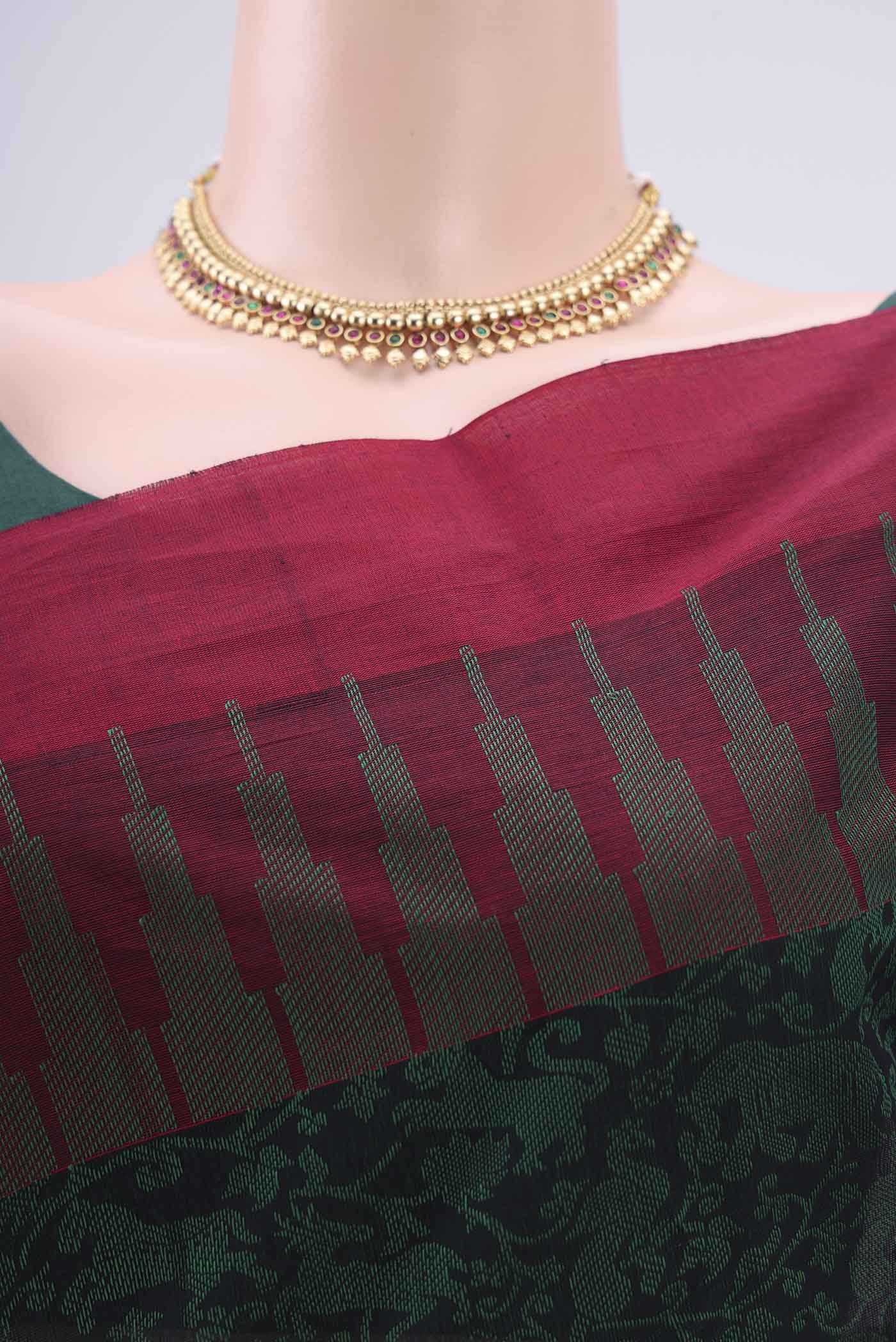 Border image of Bottle Green Kanchi Cotton Saree with Jacquard design on the body and Thread Border. 