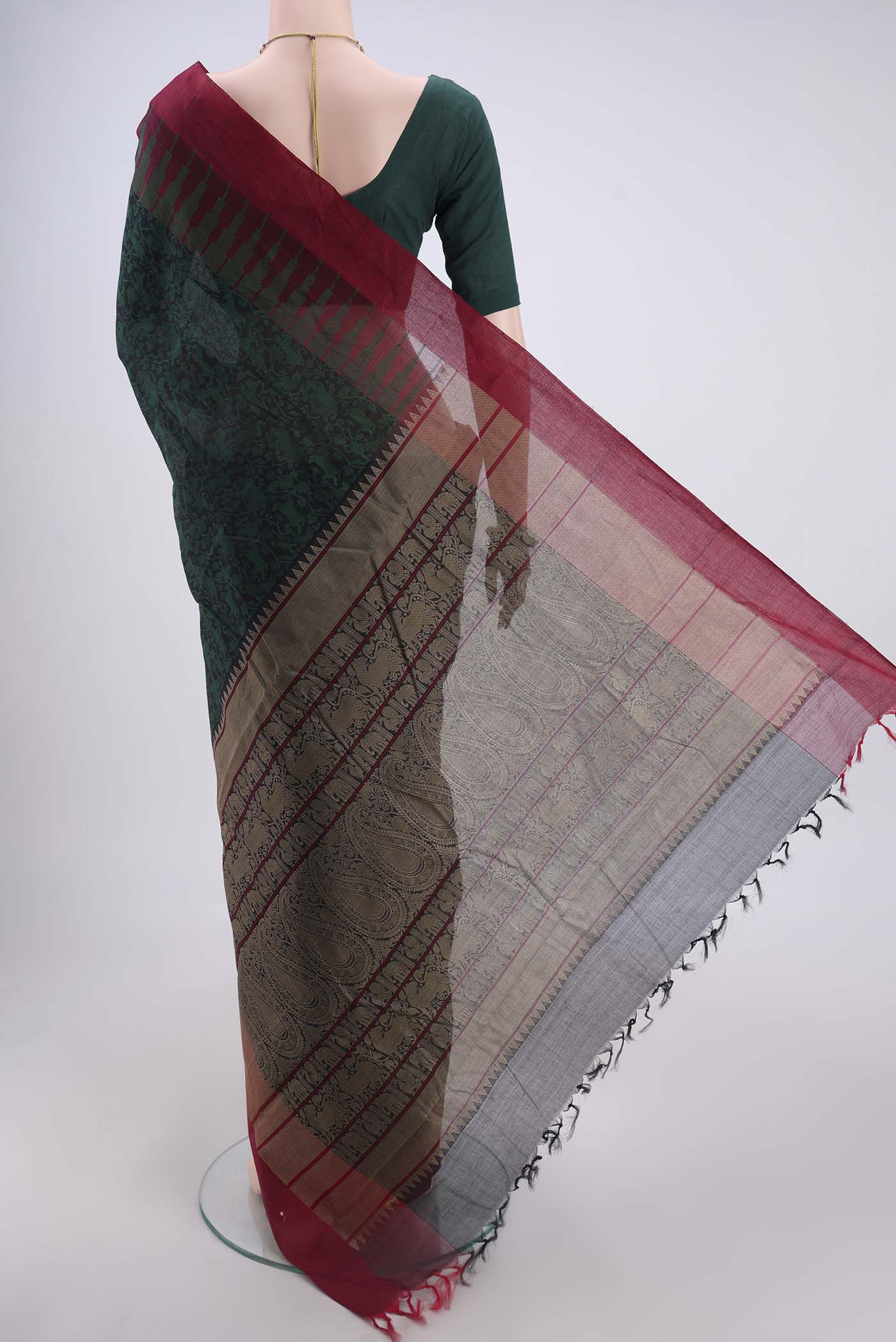 Flat view of Bottle Green Kanchi Cotton Saree with Jacquard design on the body and Thread Border. 