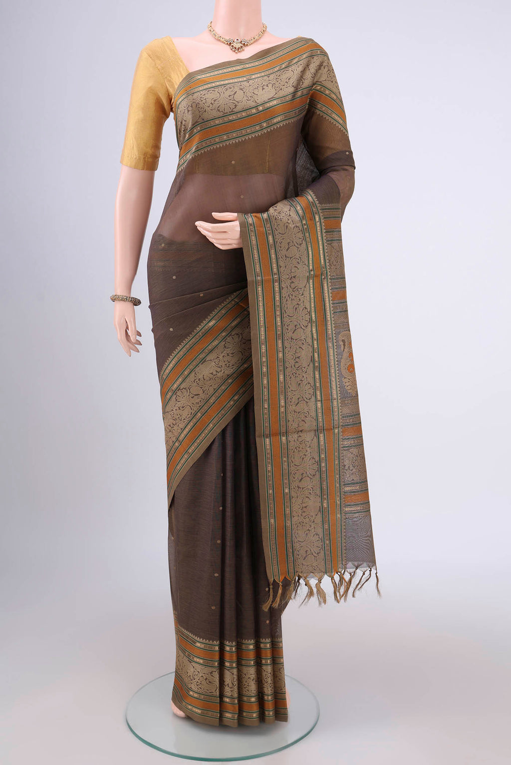 Davys Grey Kanjivaram Saree with Zari Butta on the body and Zari Border.  displayed on a mannequin