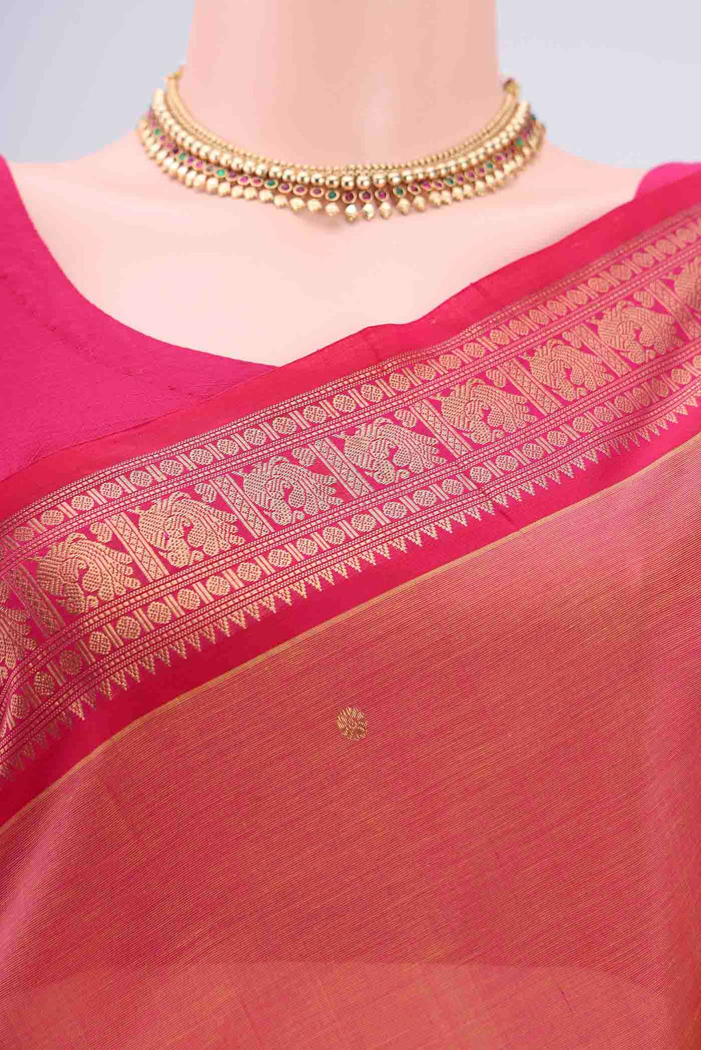 Border image of Peach Kanjivaram Saree with Zari Butta on the body and Zari Border. 