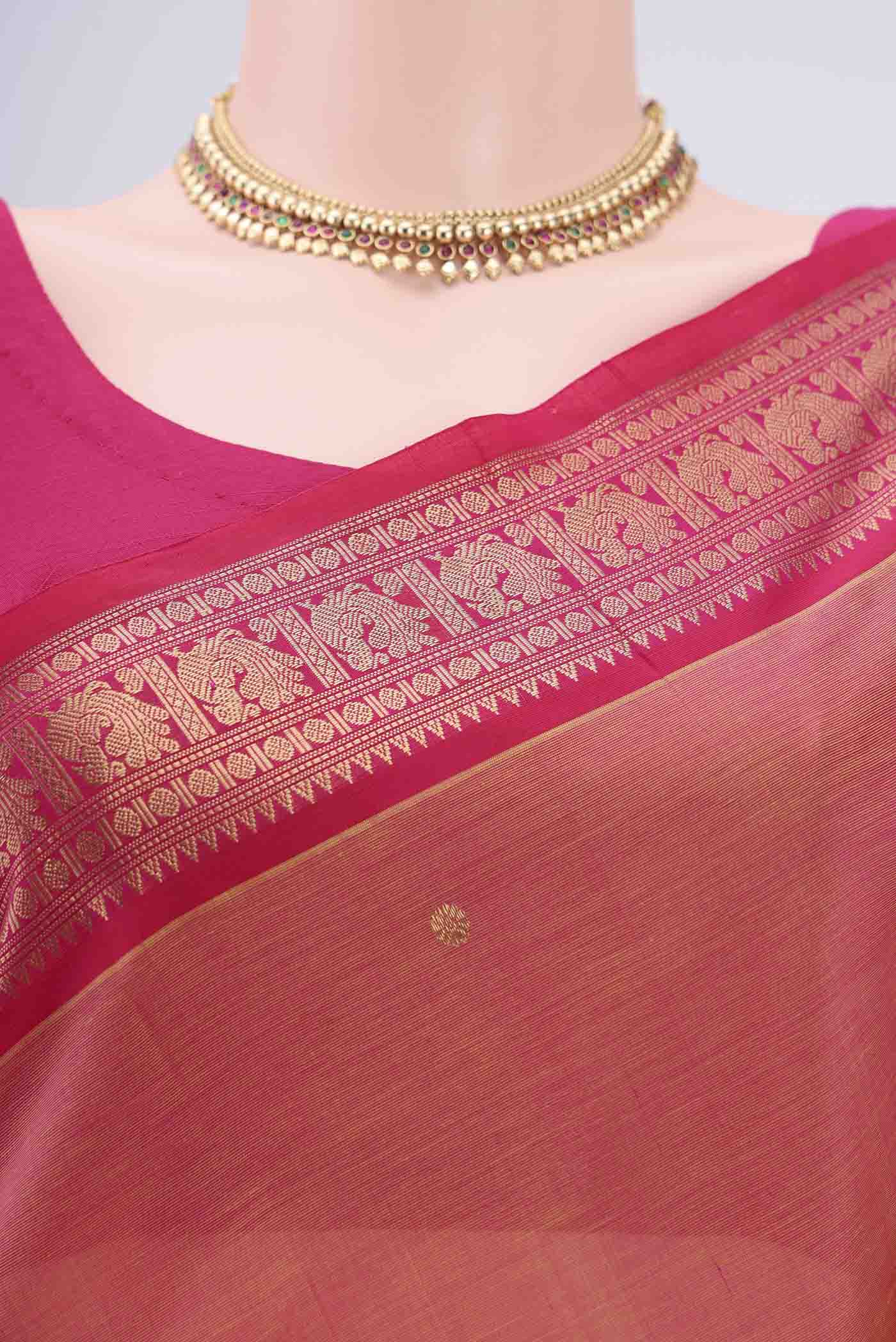 Border image of Peach Kanjivaram Saree with Zari Butta on the body and Zari Border. 