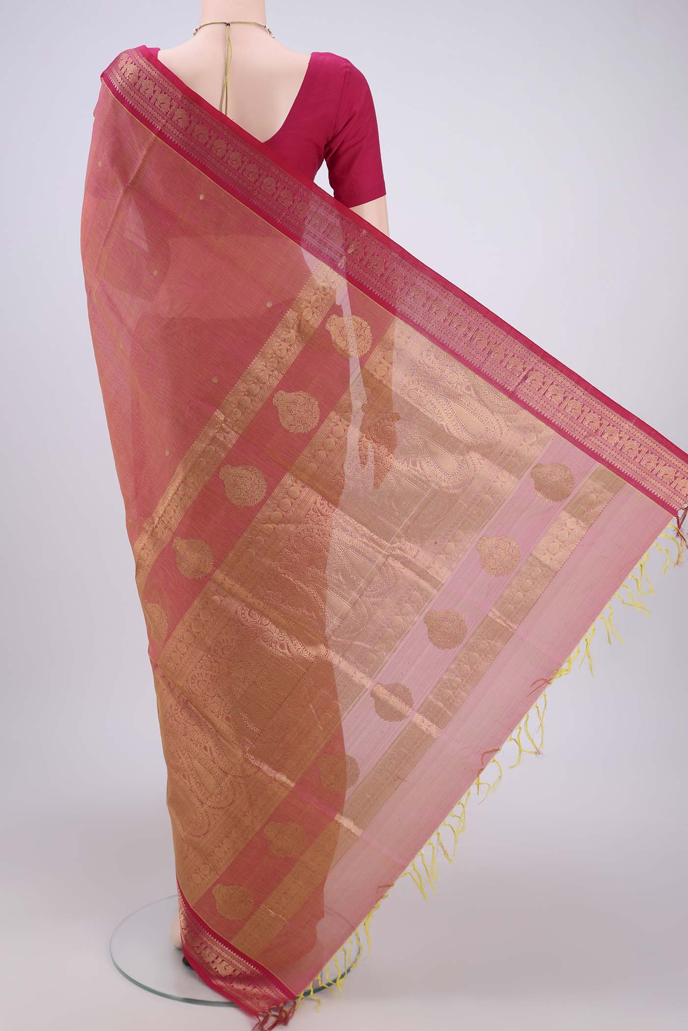 Flat view of Peach Kanjivaram Saree with Zari Butta on the body and Zari Border. 