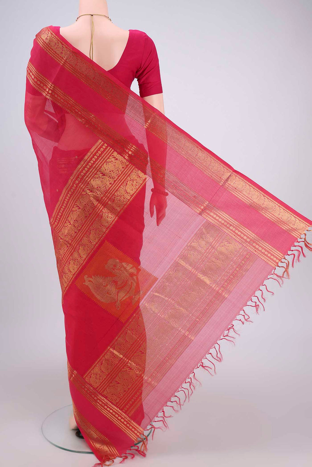 Flat view of Dark Pink Kanjivaram Saree with Zari Butta on the body and Zari Border. 