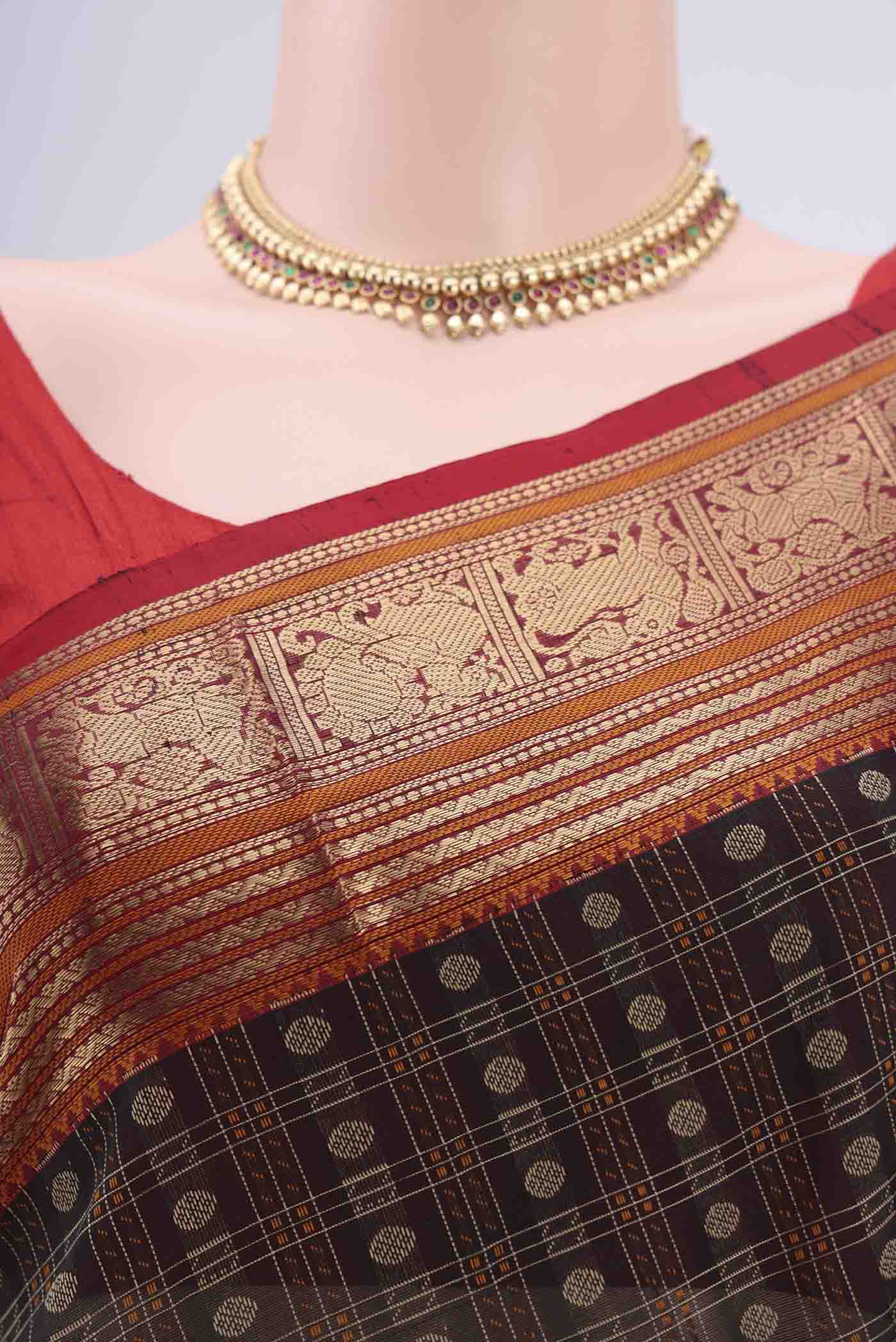 Border image of Black Kanjivaram Saree with Checked design on the body and Zari Border. 