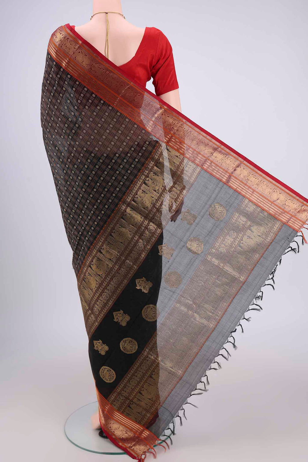 Flat view of Black Kanjivaram Saree with Checked design on the body and Zari Border. 