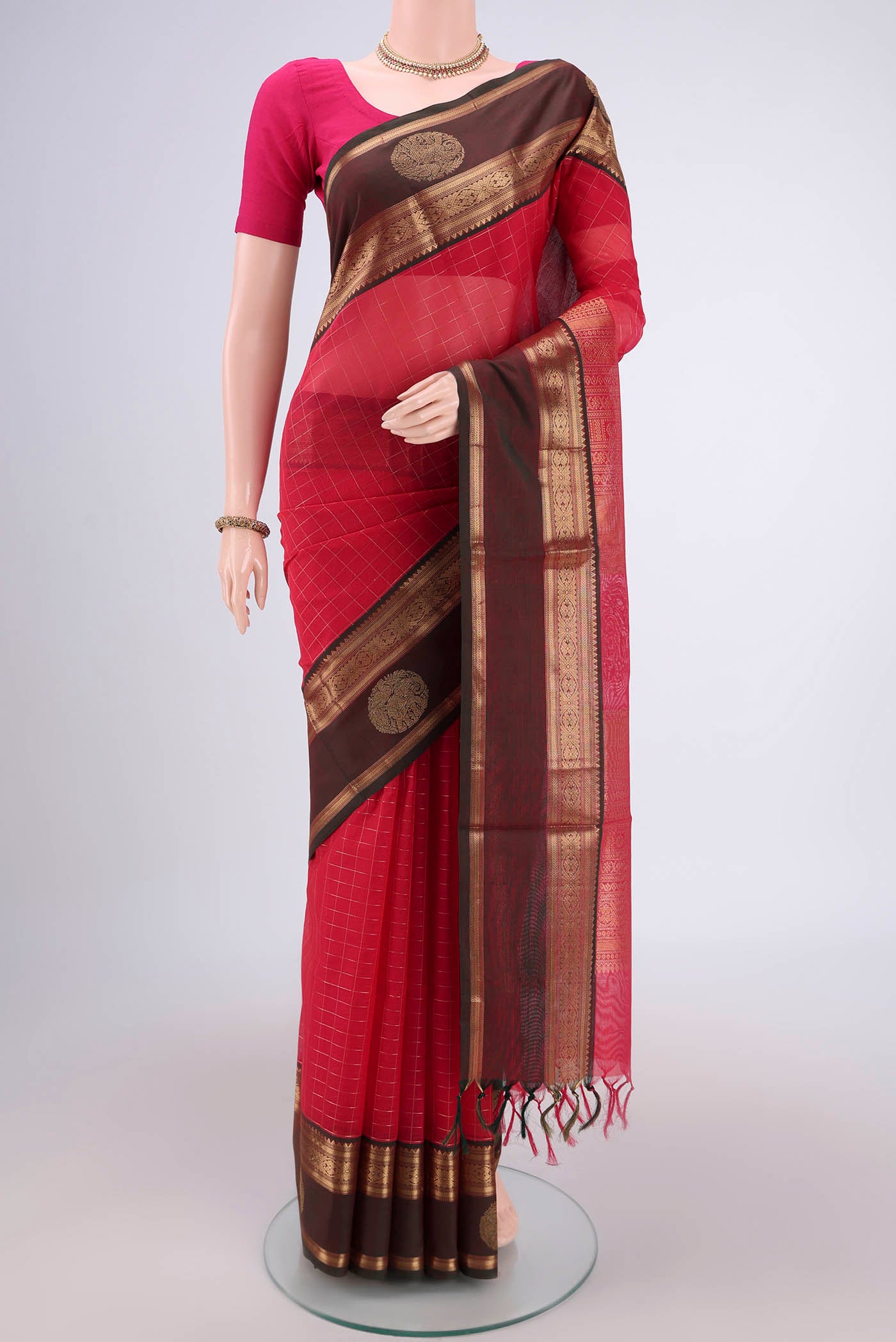 Dark Pink Kanjivaram Saree with Checked design on the body and Zari Border.  displayed on a mannequin