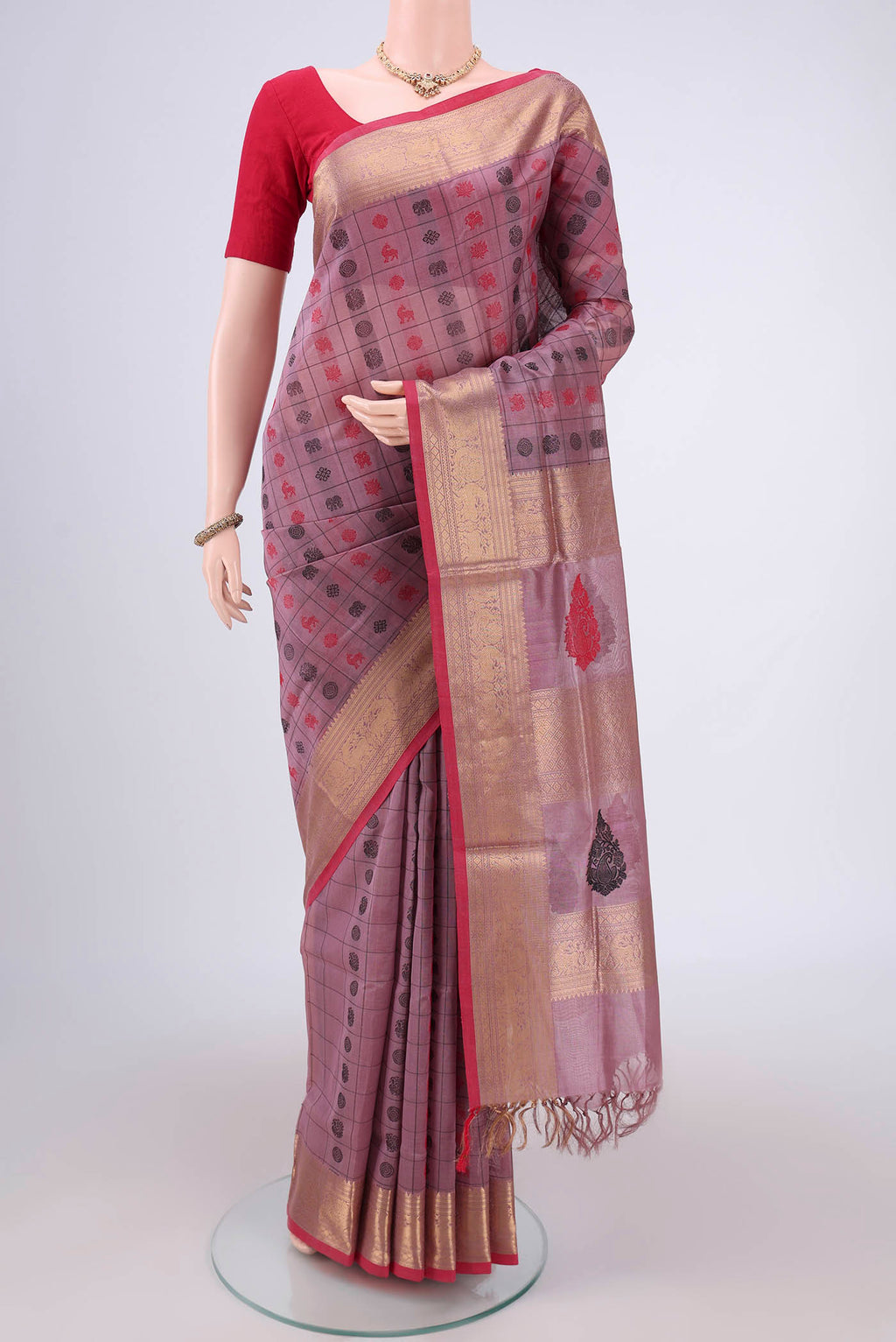Lavender Kanjivaram Saree with Checked design on the body and Zari Border.  displayed on a mannequin