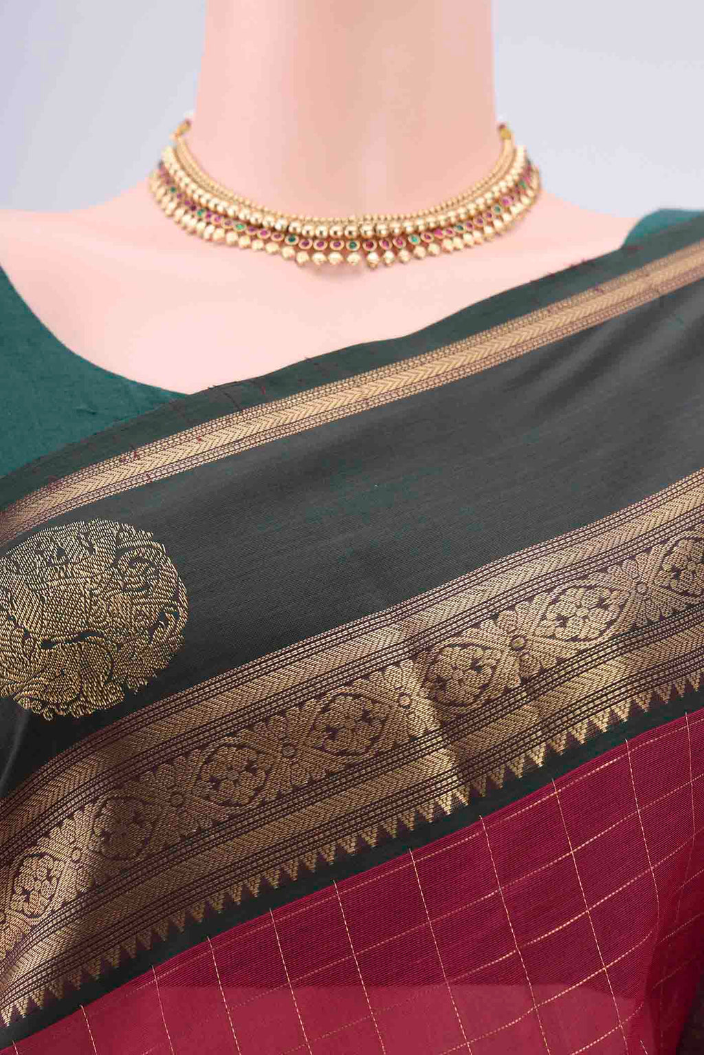 Border image of Maroon Kanjivaram Saree with Checked design on the body and Zari Border. 