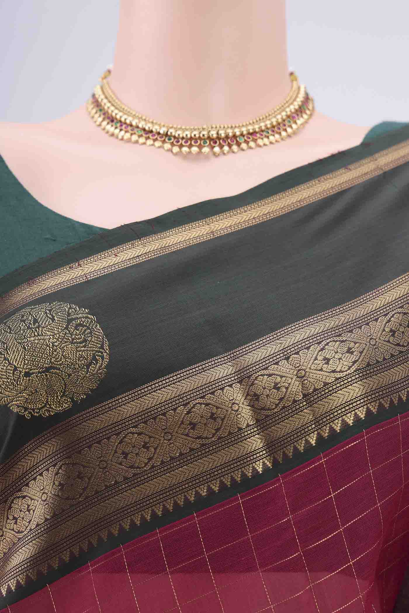 Border image of Maroon Kanjivaram Saree with Checked design on the body and Zari Border. 