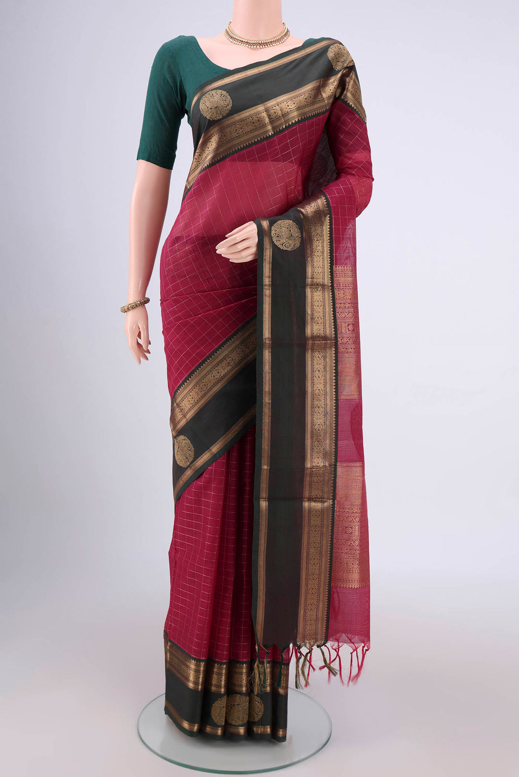 Maroon Kanjivaram Saree with Checked design on the body and Zari Border.  displayed on a mannequin