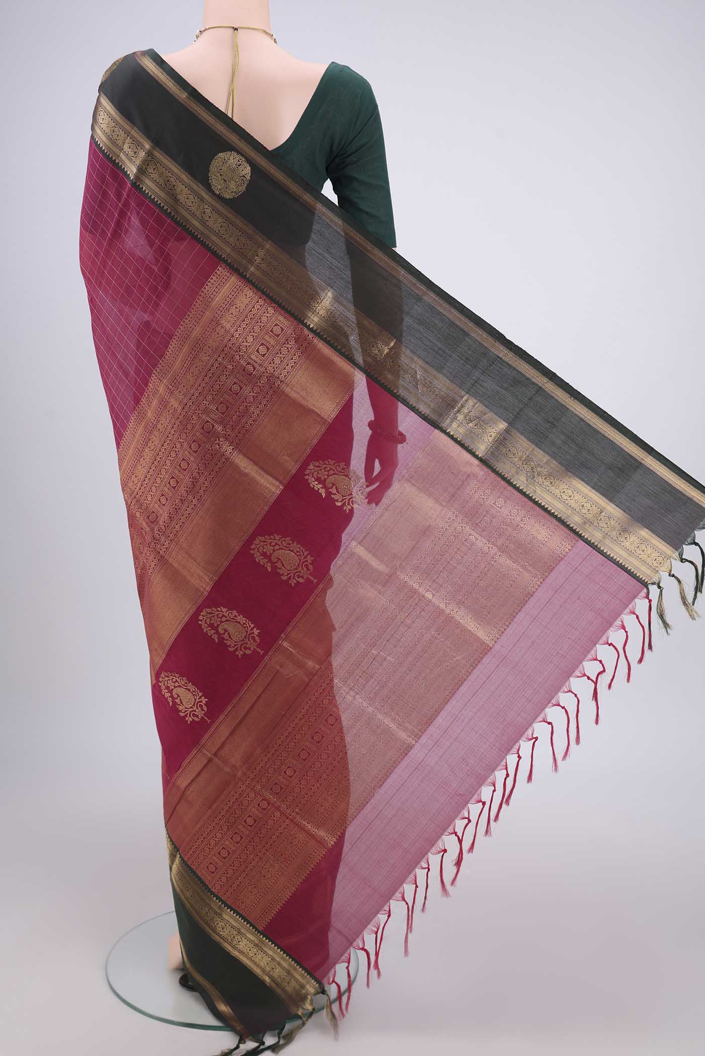 Flat view of Maroon Kanjivaram Saree with Checked design on the body and Zari Border. 