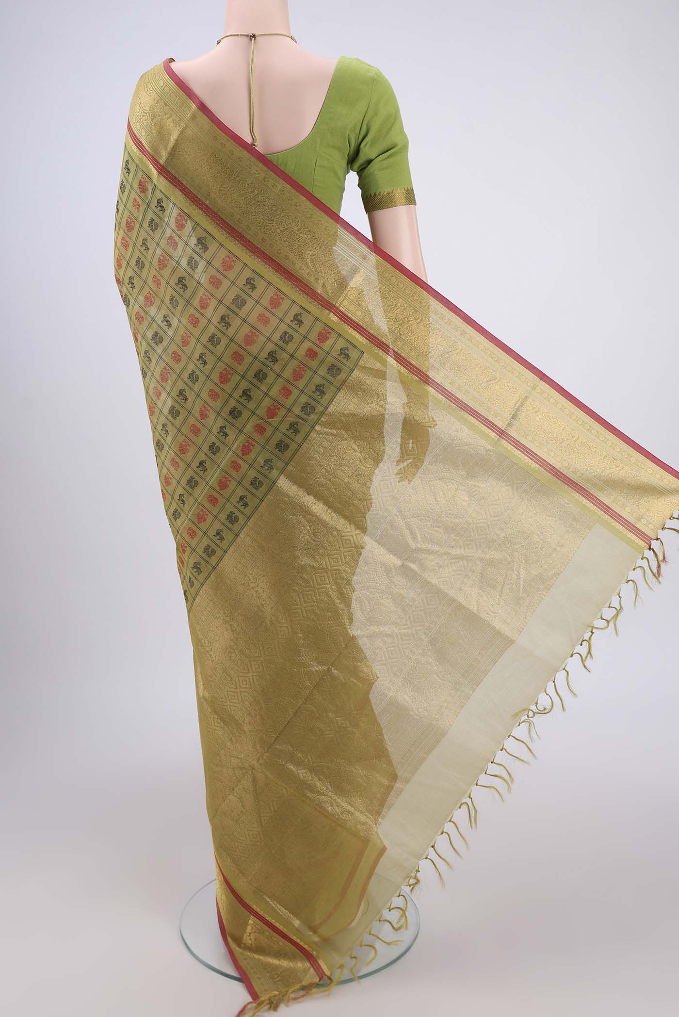 Flat view of Light Green Kanjivaram Saree with Checked design on the body and Zari Border. 