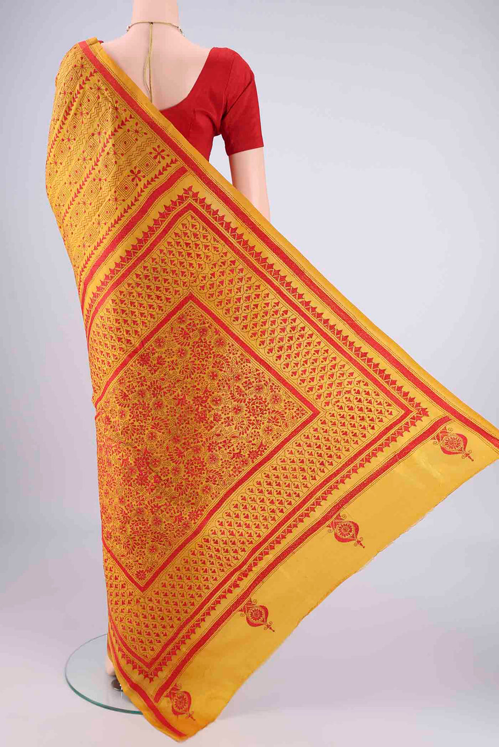 Flat view of Mustard Kantha Silk Saree with Kantha Work on the body and Thread Border. 