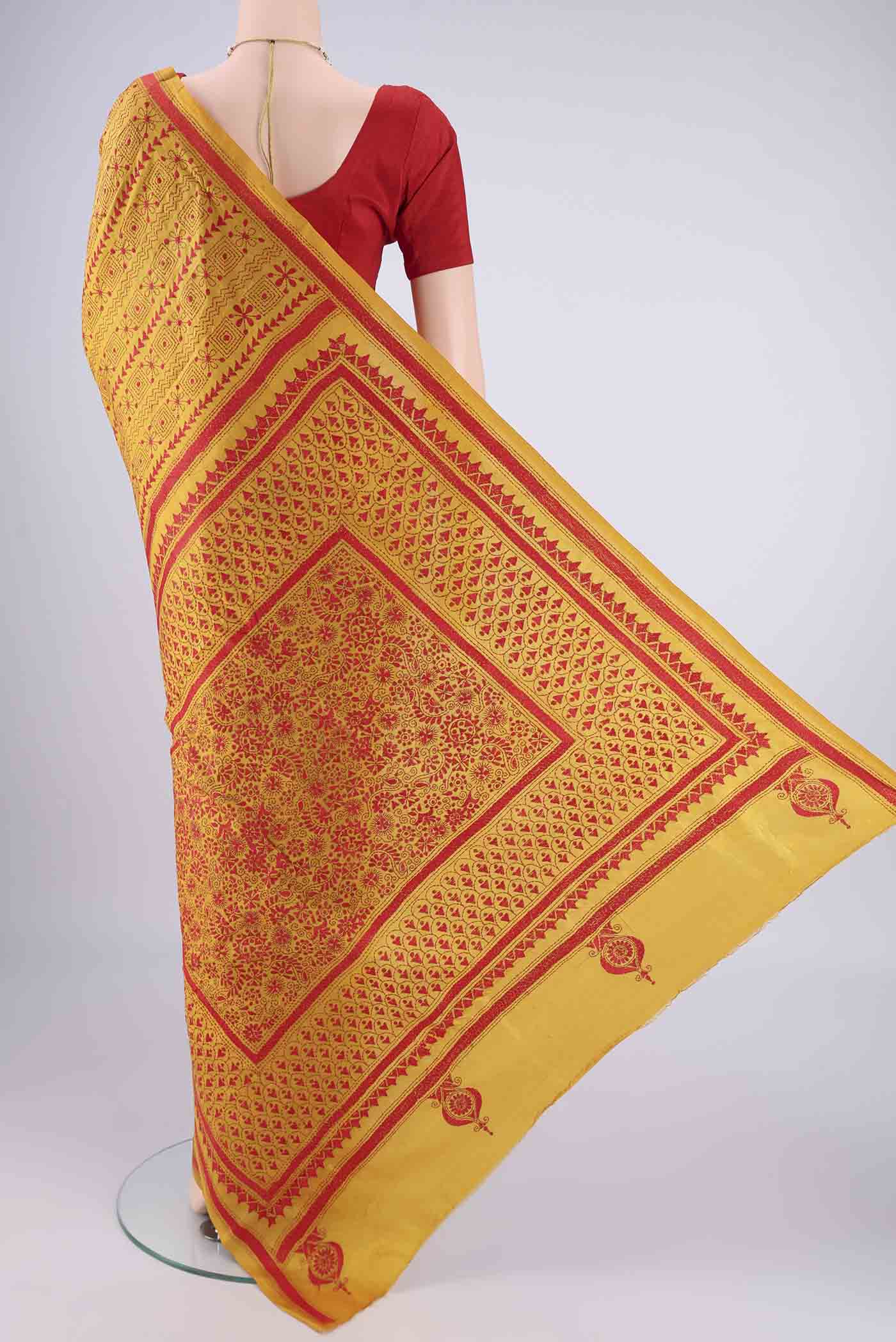 Flat view of Mustard Kantha Silk Saree with Kantha Work on the body and Thread Border. 