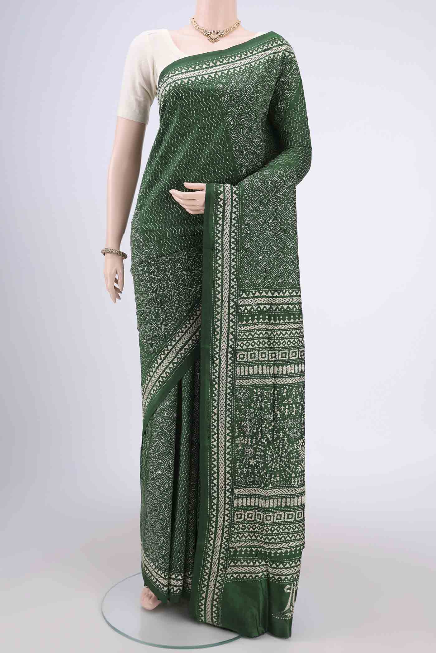 Bottle Green Kantha Silk Saree with Kantha Work on the body and Thread Border.  displayed on a mannequin