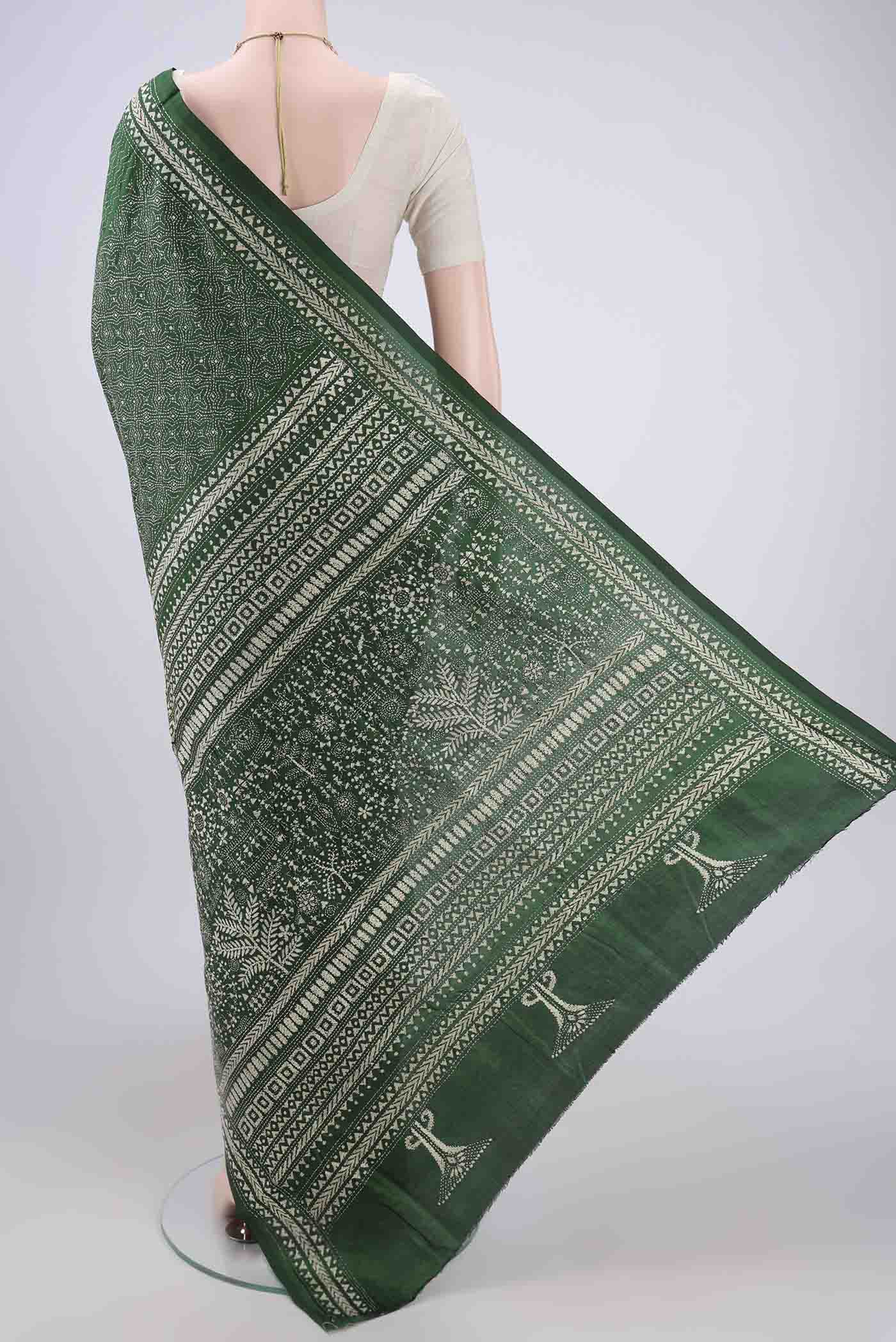 Flat view of Bottle Green Kantha Silk Saree with Kantha Work on the body and Thread Border. 