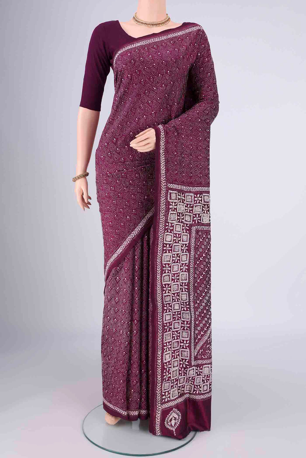 Magenta Kantha Silk Saree with Kantha Work on the body and Thread Border.  displayed on a mannequin