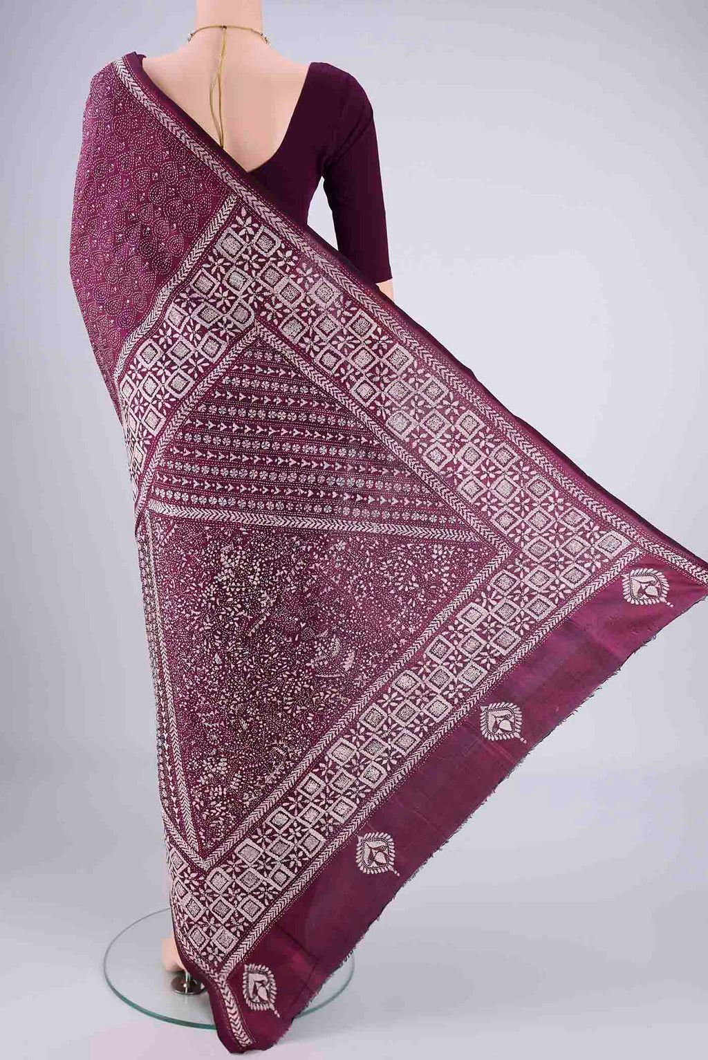 Flat view of Magenta Kantha Silk Saree with Kantha Work on the body and Thread Border. 