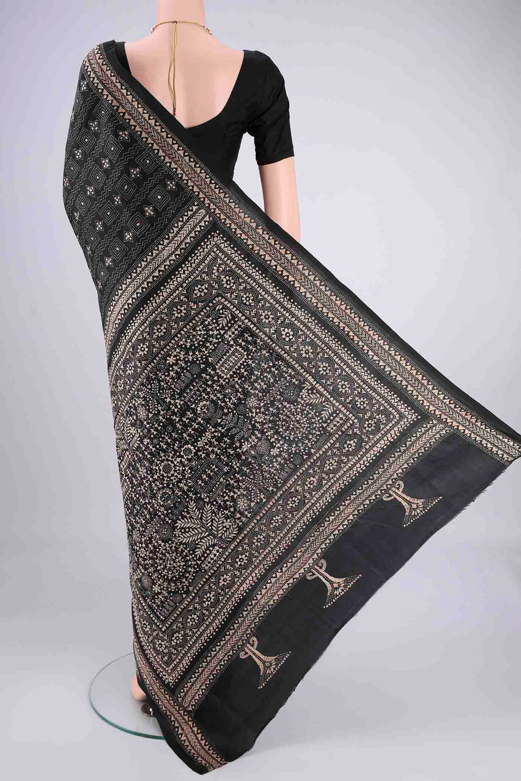 Flat view of Black Kantha Silk Saree with Kantha Work on the body and Thread Border. 
