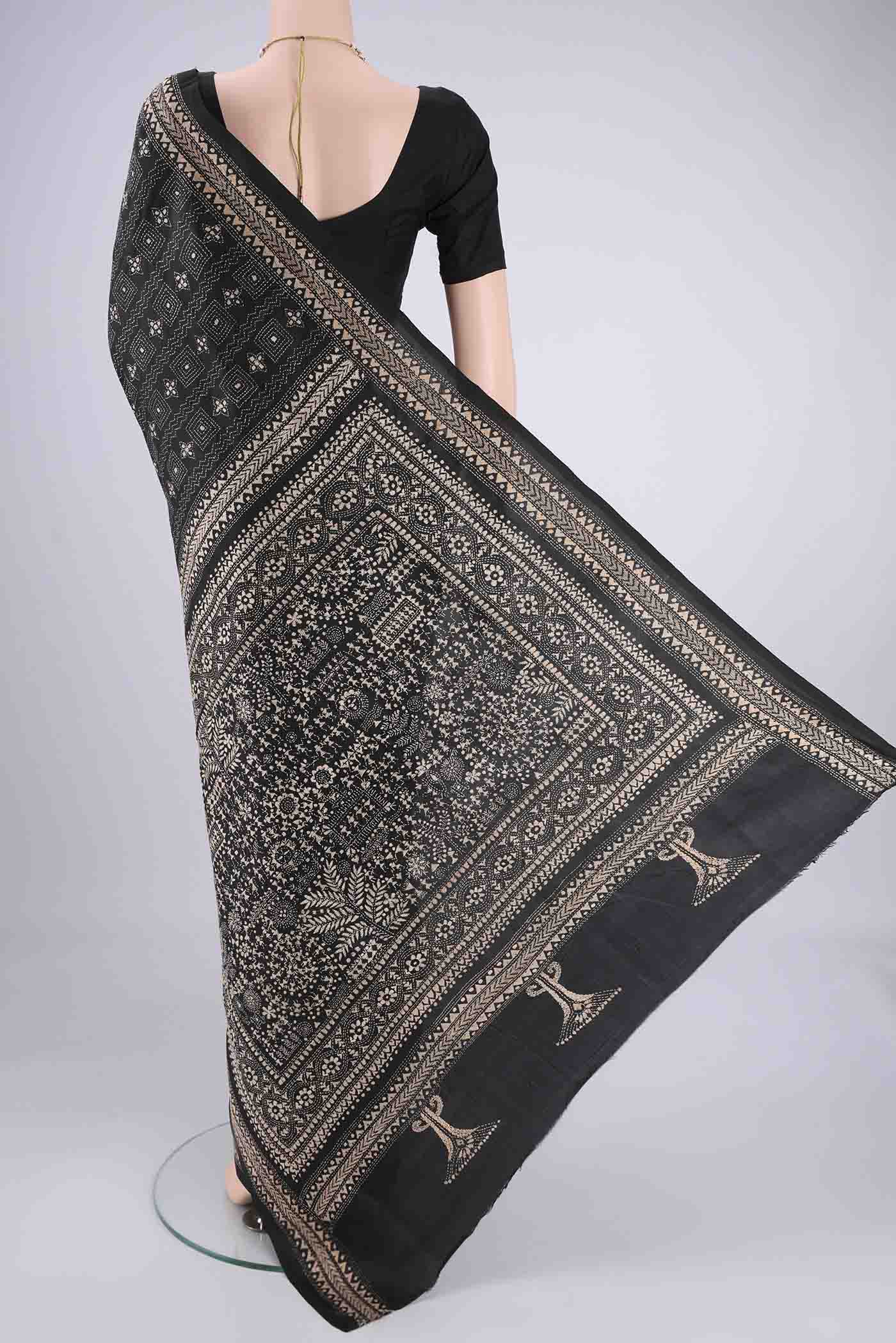 Flat view of Black Kantha Silk Saree with Kantha Work on the body and Thread Border. 