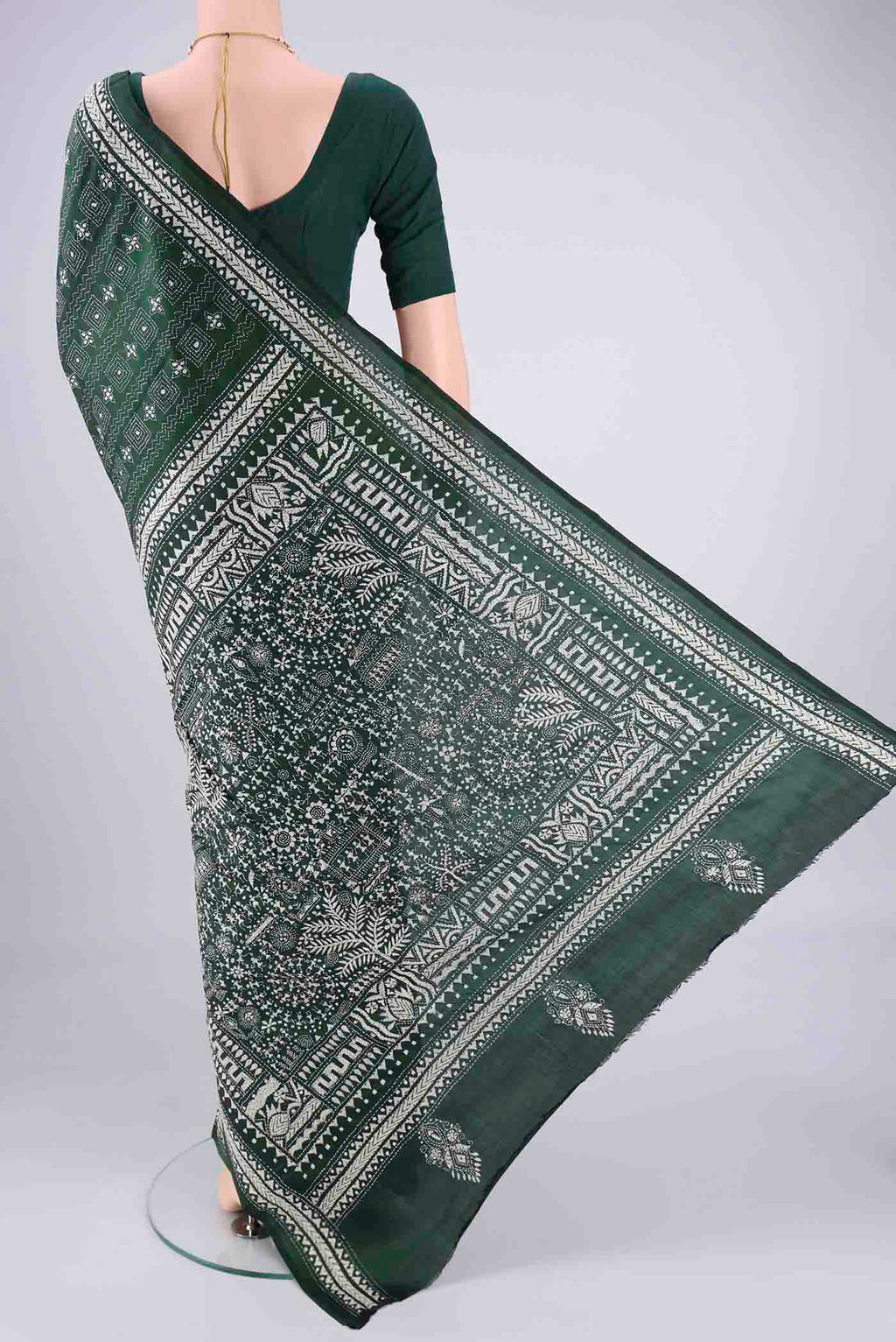 Flat view of Bottle Green Kantha Silk Saree with Kantha Work on the body and Thread Border. 