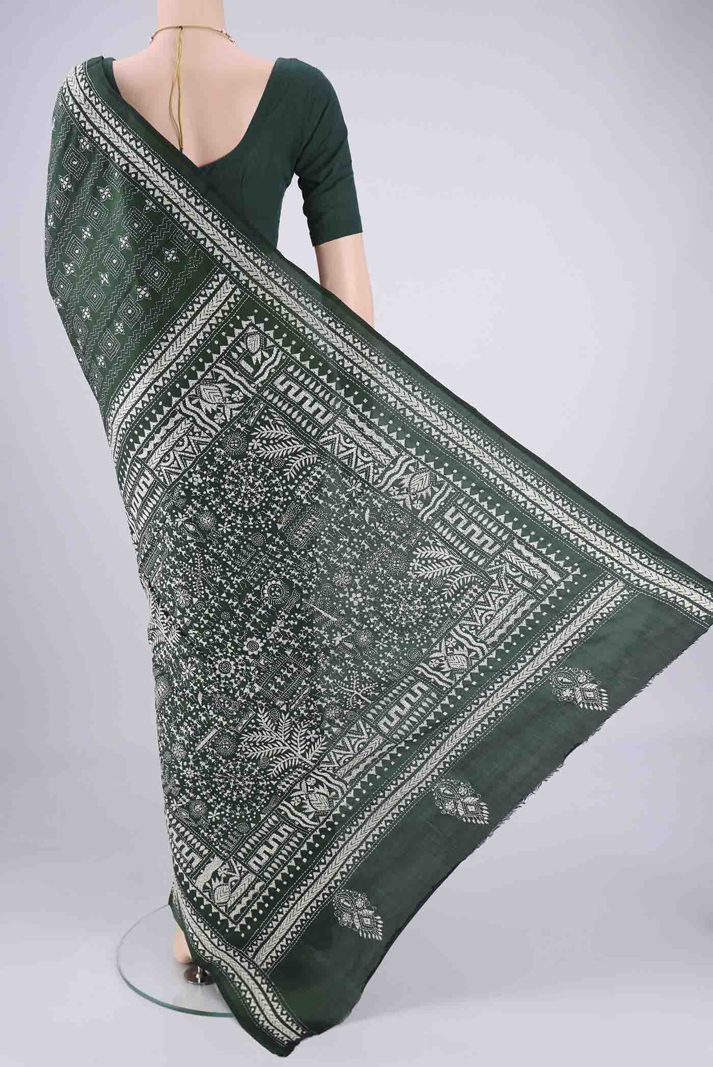 Flat view of Bottle Green Kantha Silk Saree with Kantha Work on the body and Thread Border. 