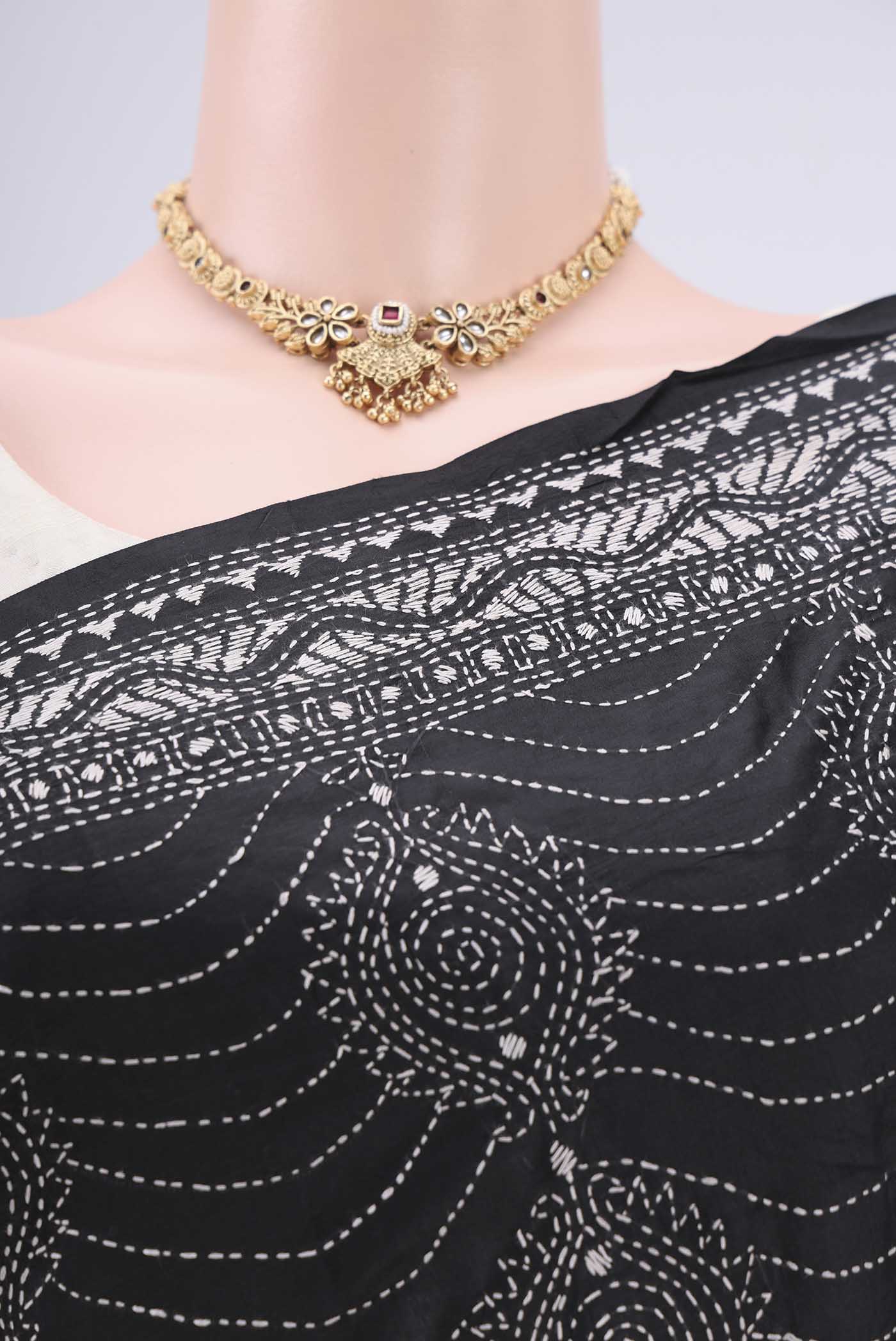 Border image of Black Kantha Silk Saree with Kantha Work on the body and Thread Border. 