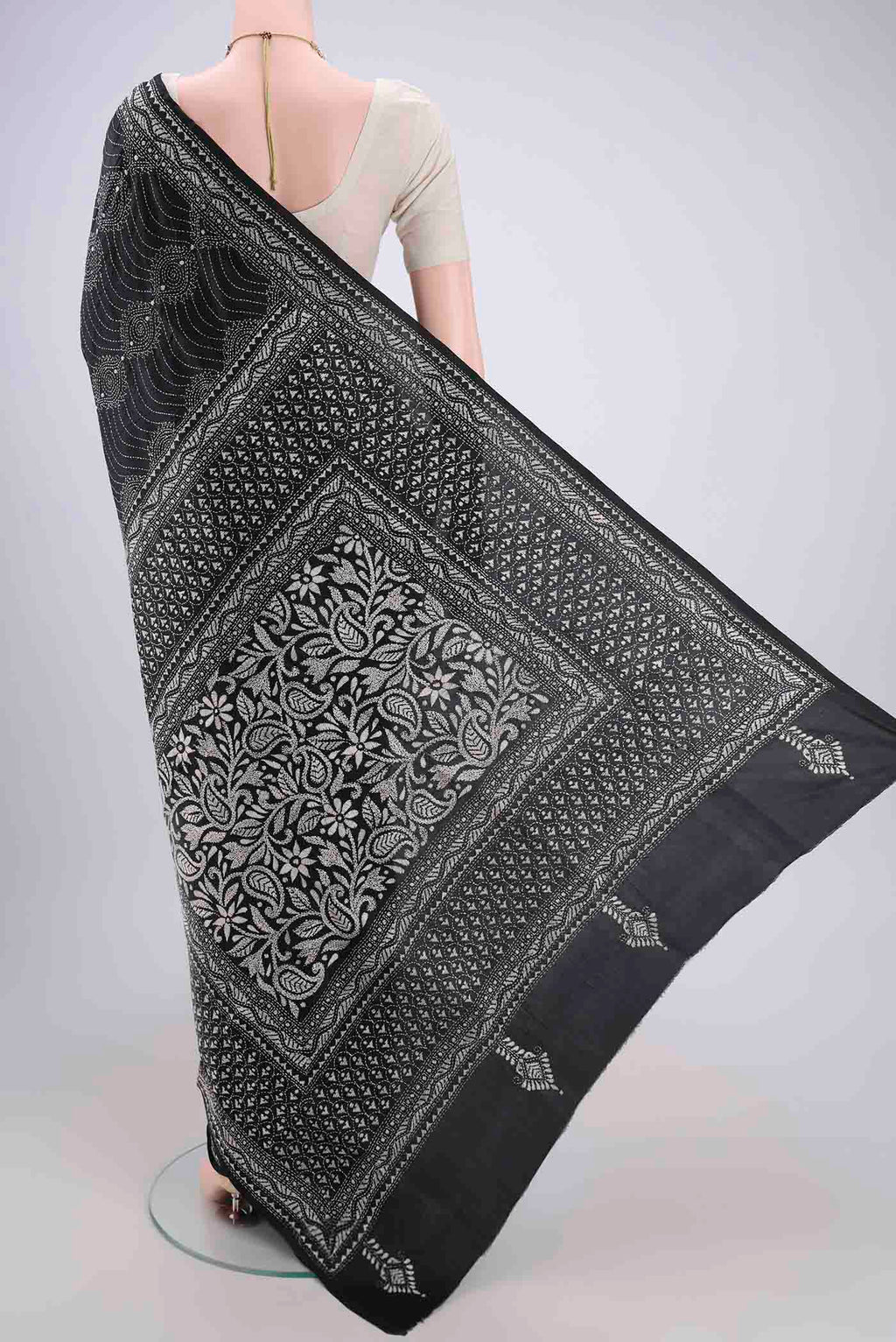 Flat view of Black Kantha Silk Saree with Kantha Work on the body and Thread Border. 